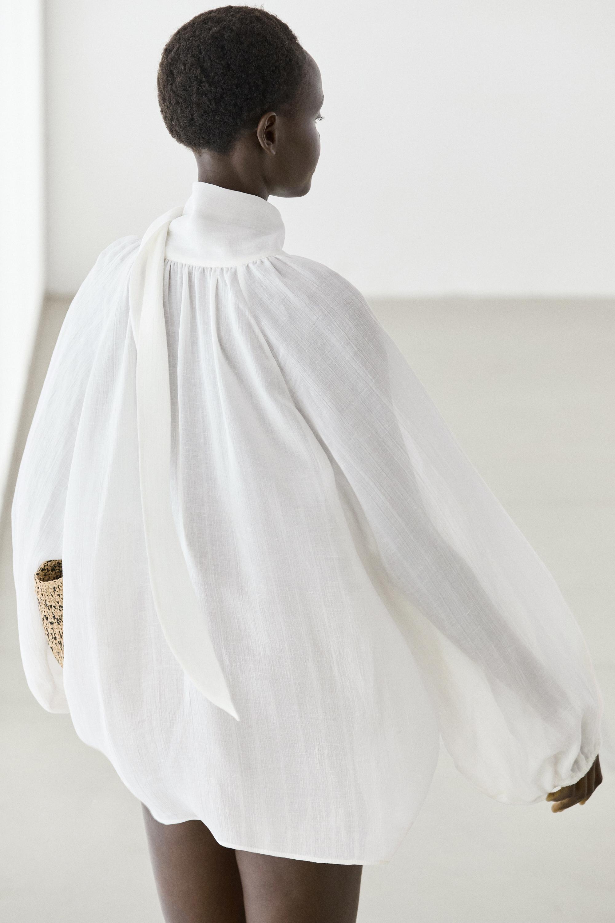 Flowing V-neck blouse with tie — WHITE