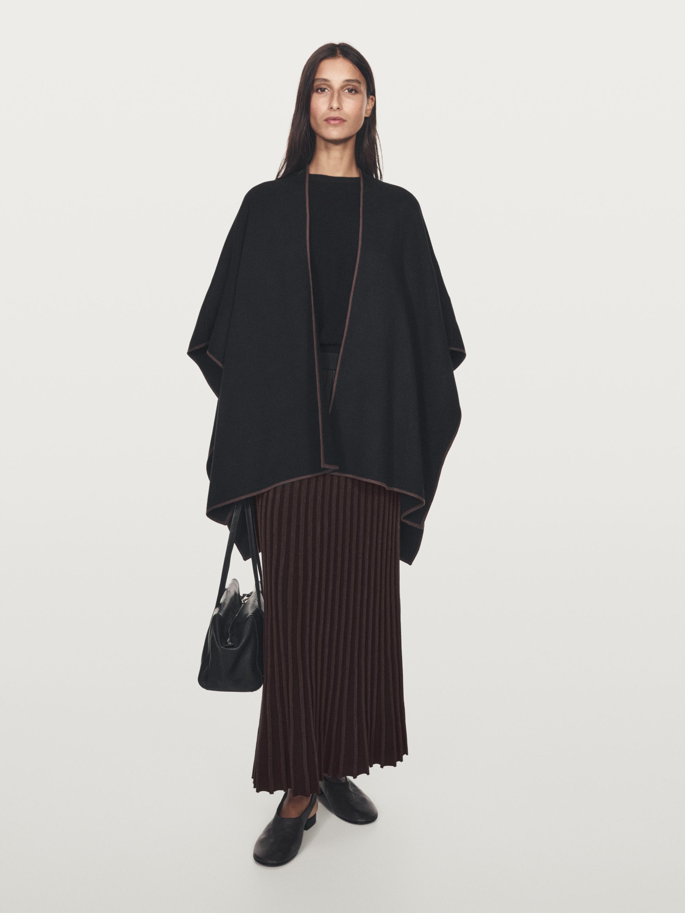 Knit cape with contrast detail