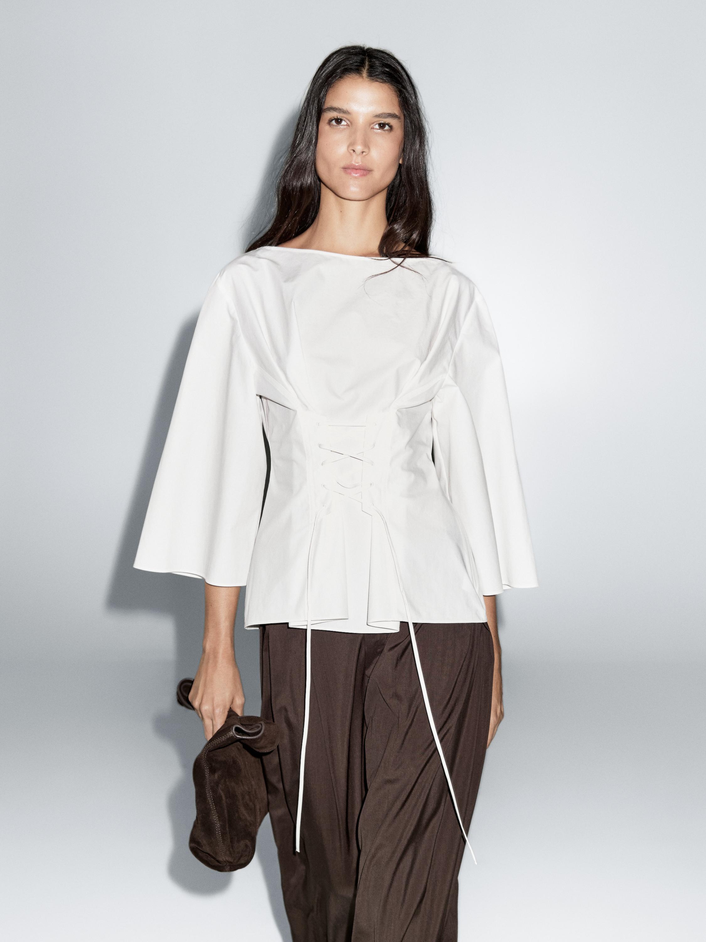 Blouse with corset detail