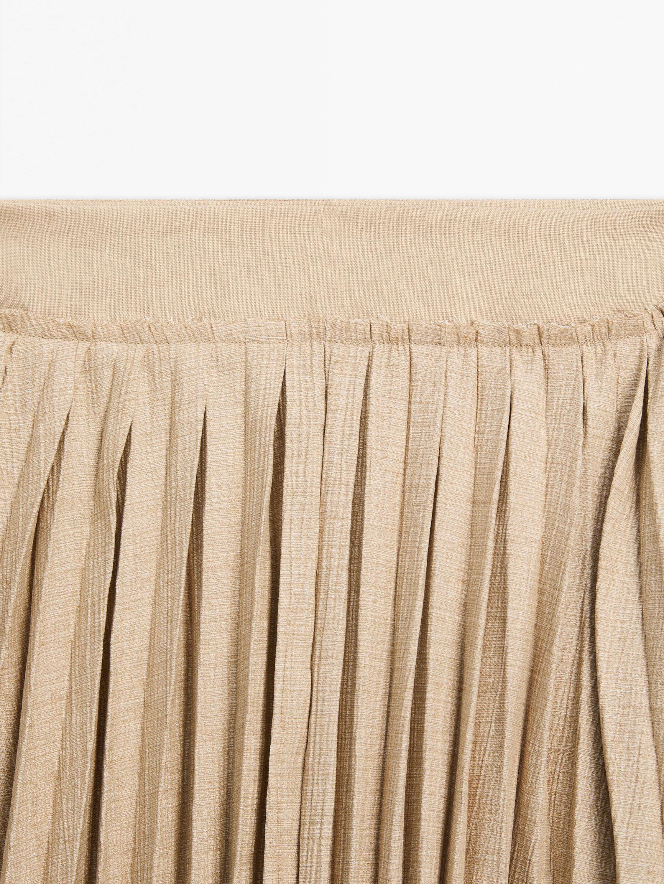 Pleated midi skirt with fabric detail