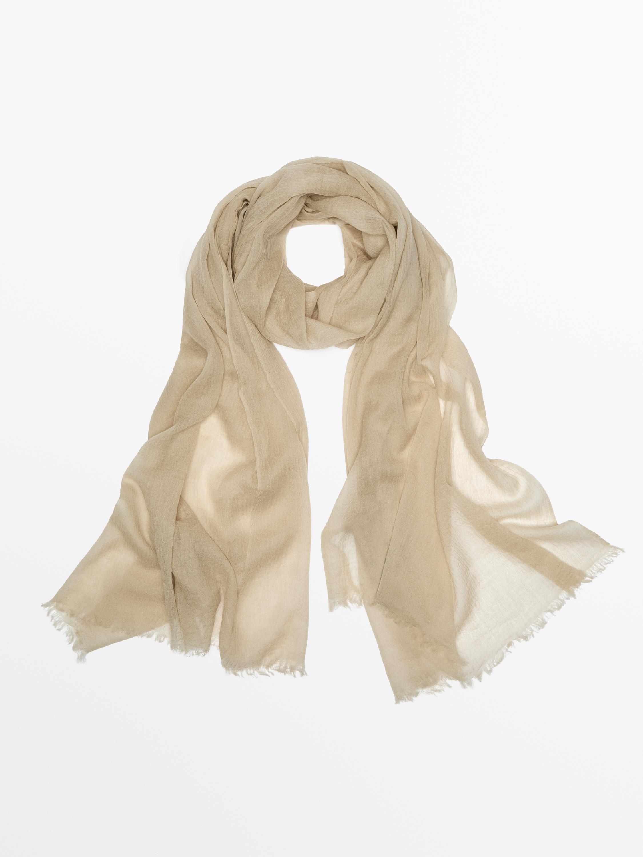 Flowing wool scarf with frayed edges
