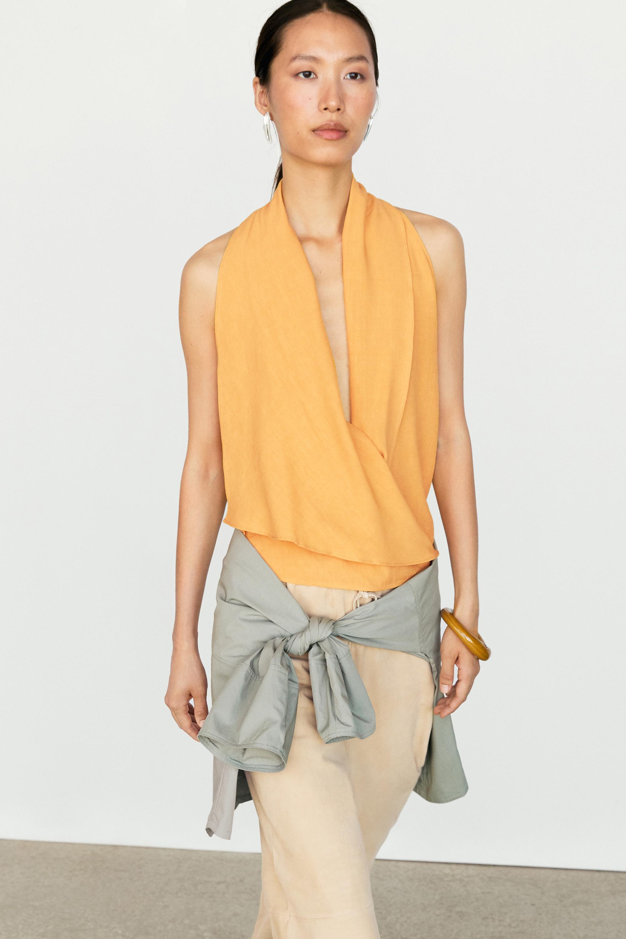 Flowing halter top with ruffle detail