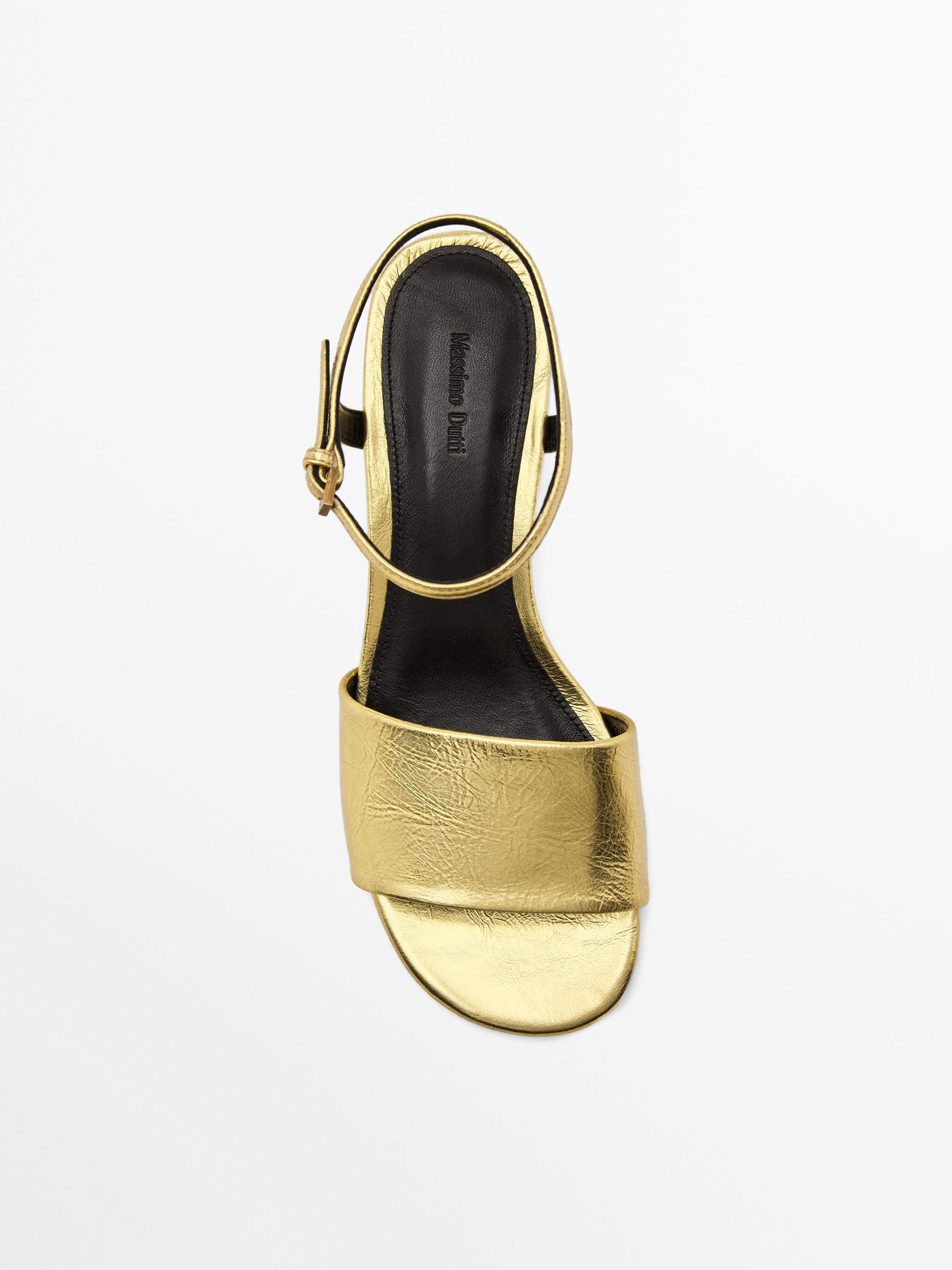 Golden slide sandals