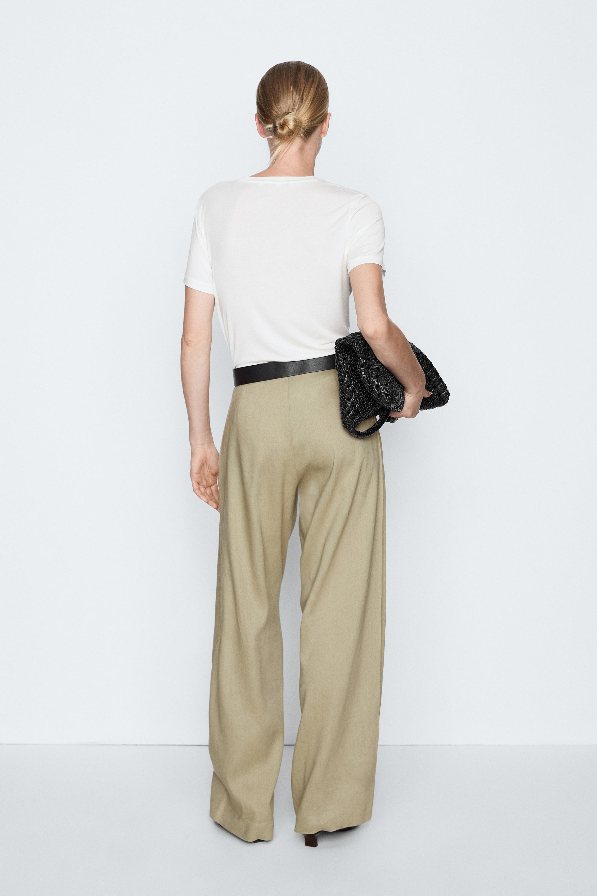 Flowing pleated pants - STUDIO — PALE KHAKI
