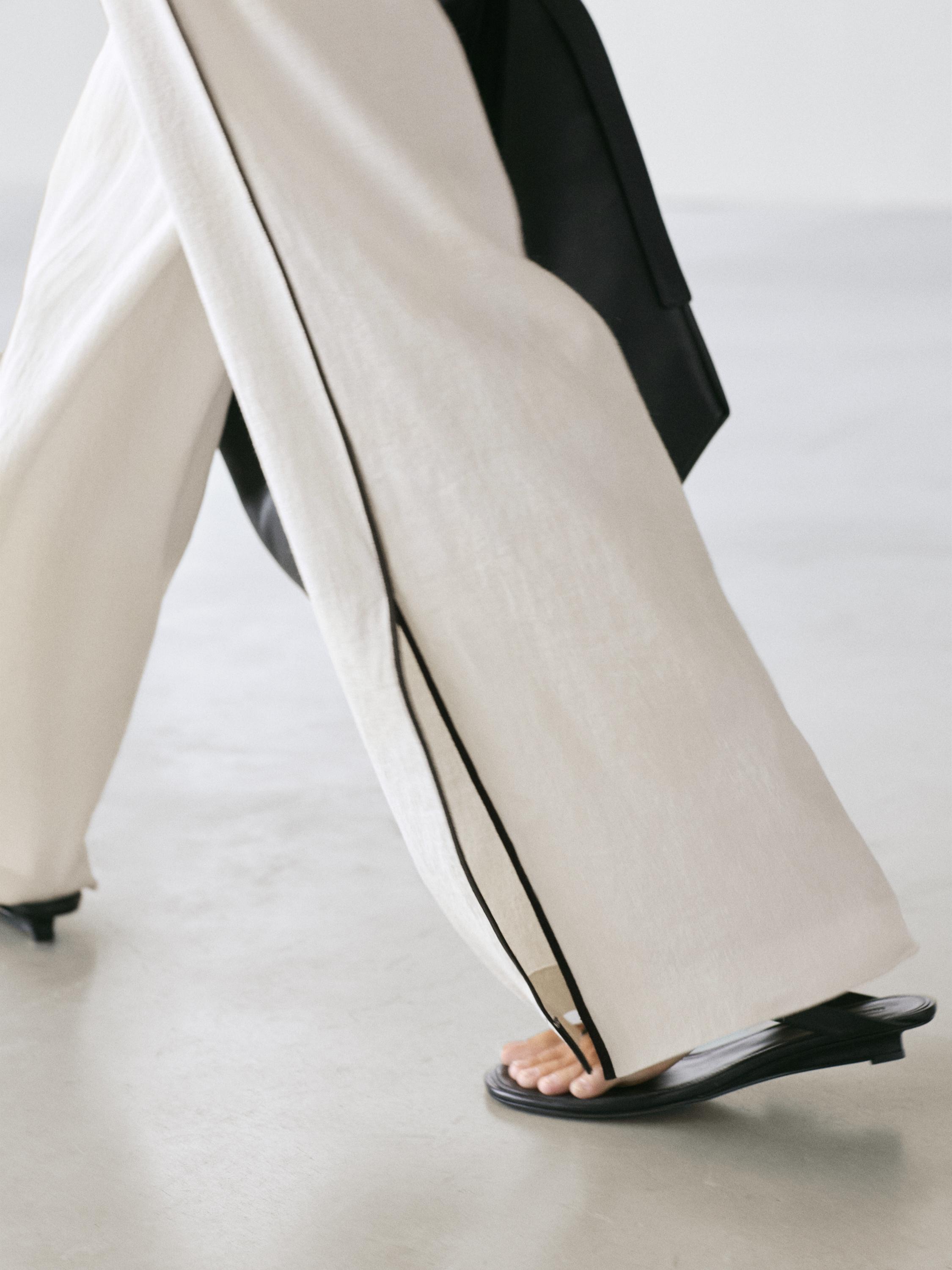 Linen trousers with contrast piping
