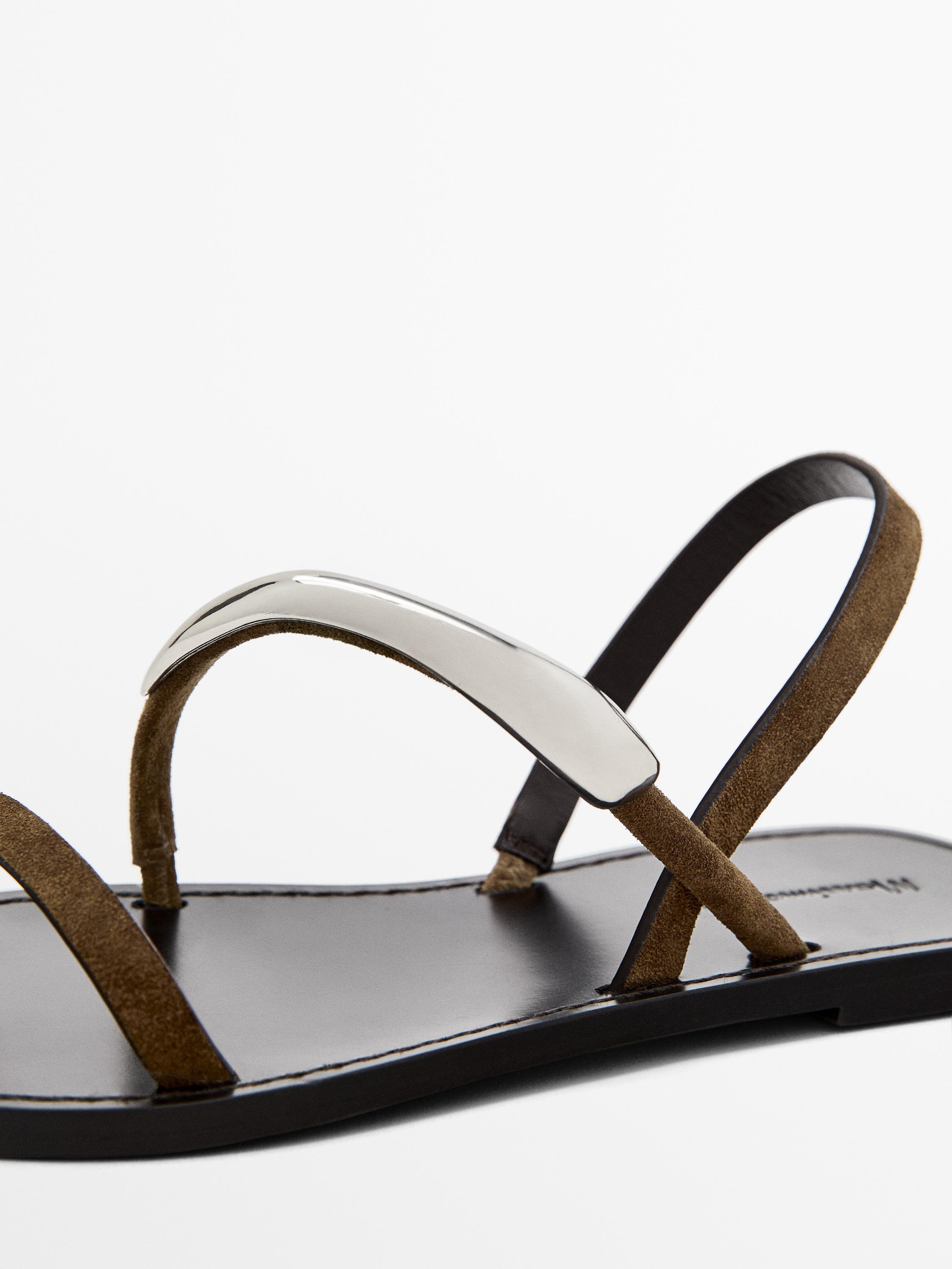 Flat sandals with metallic embellishment