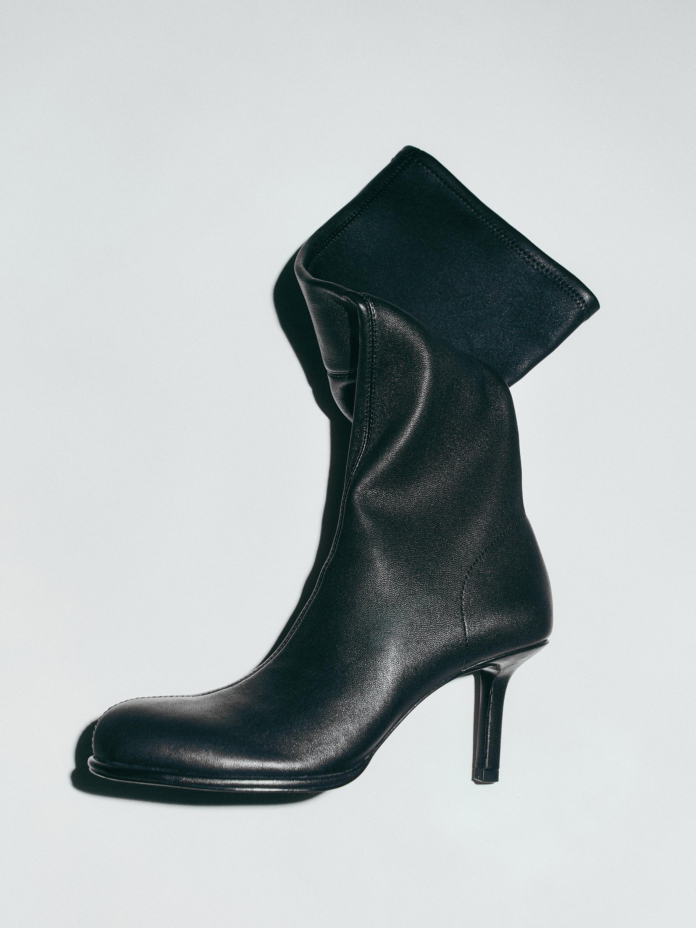 High-heel boots with rounded vamp