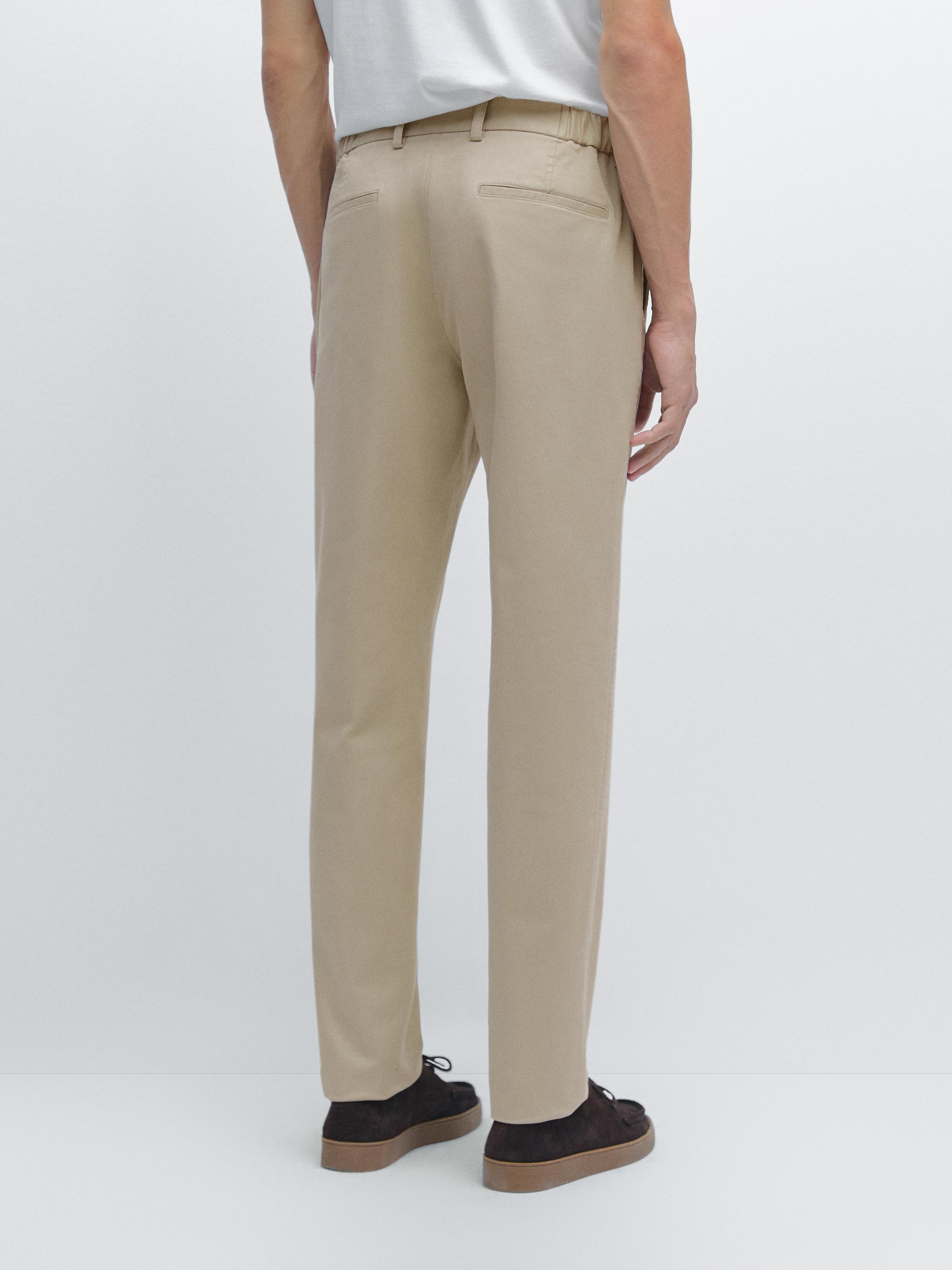 Slim fit trousers with elastic side detail
