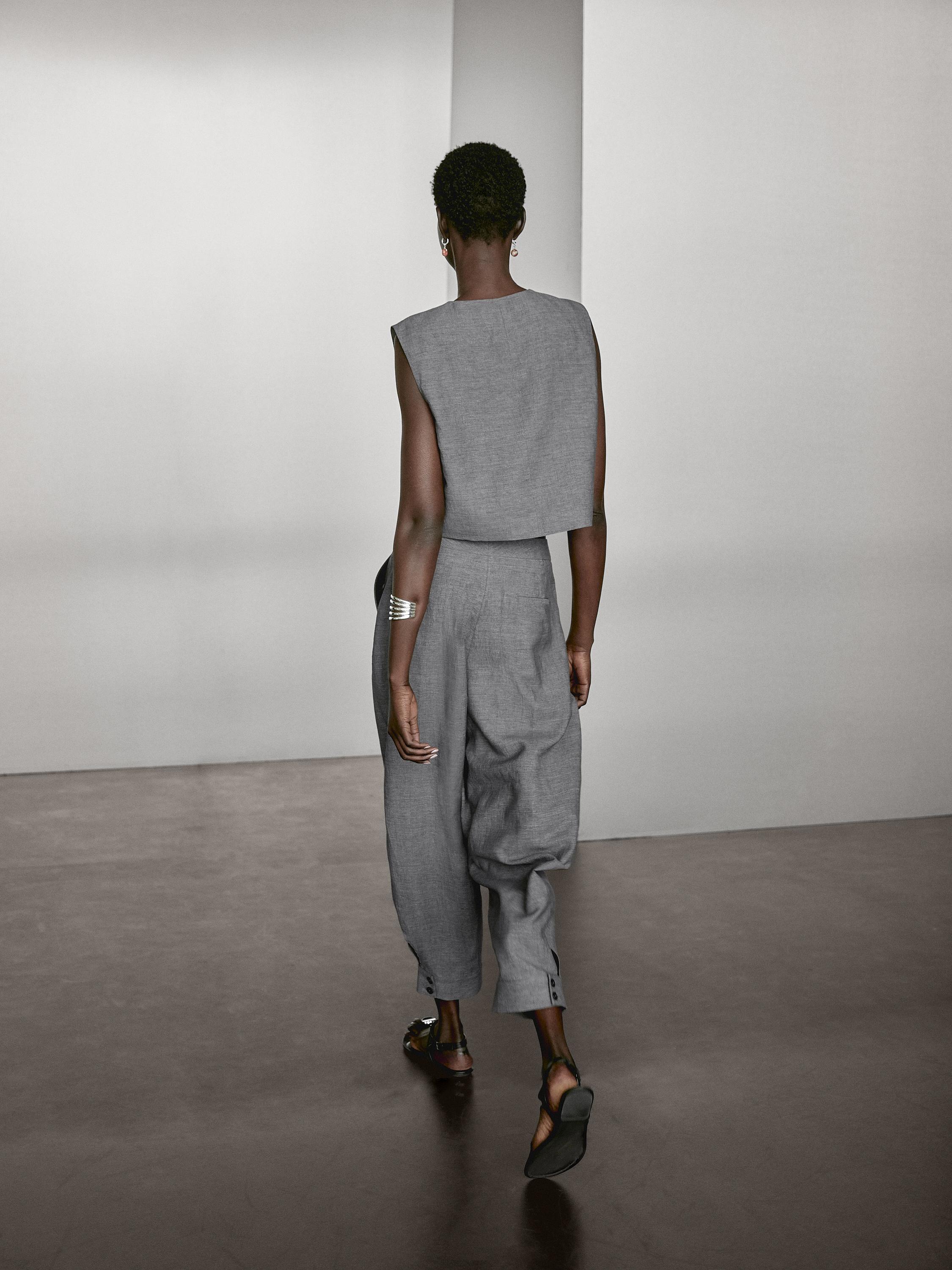 Balloon fit trousers with button details