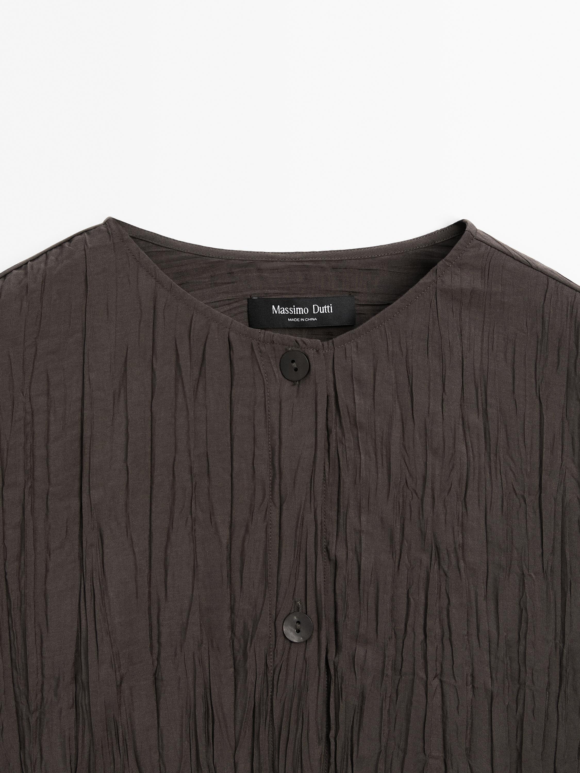 Flowing pleated bomber-style shirt
