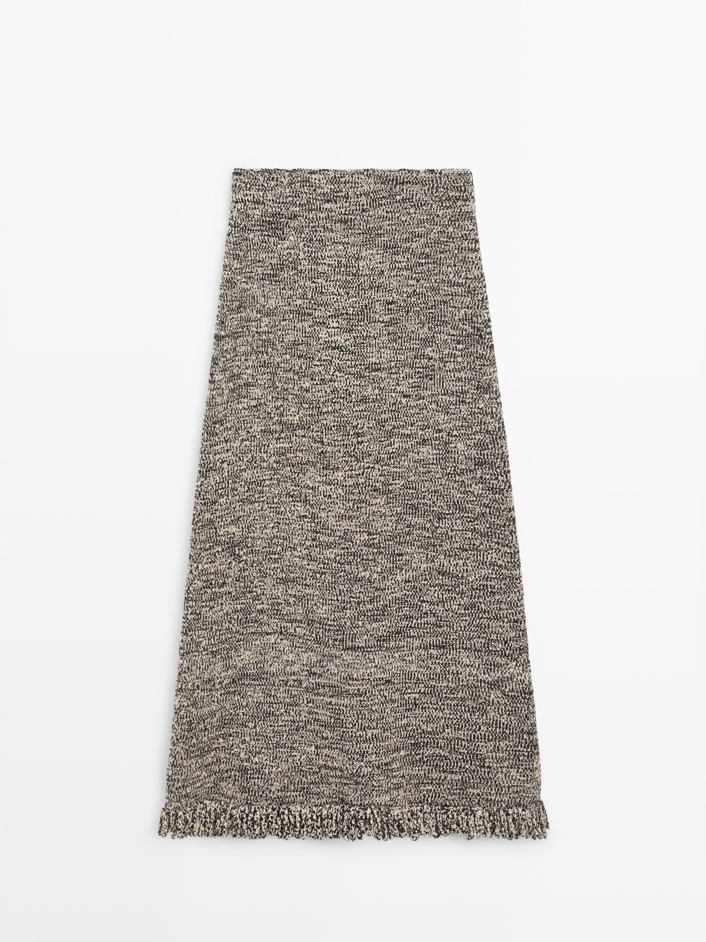 Falda punto detalle flecos total look