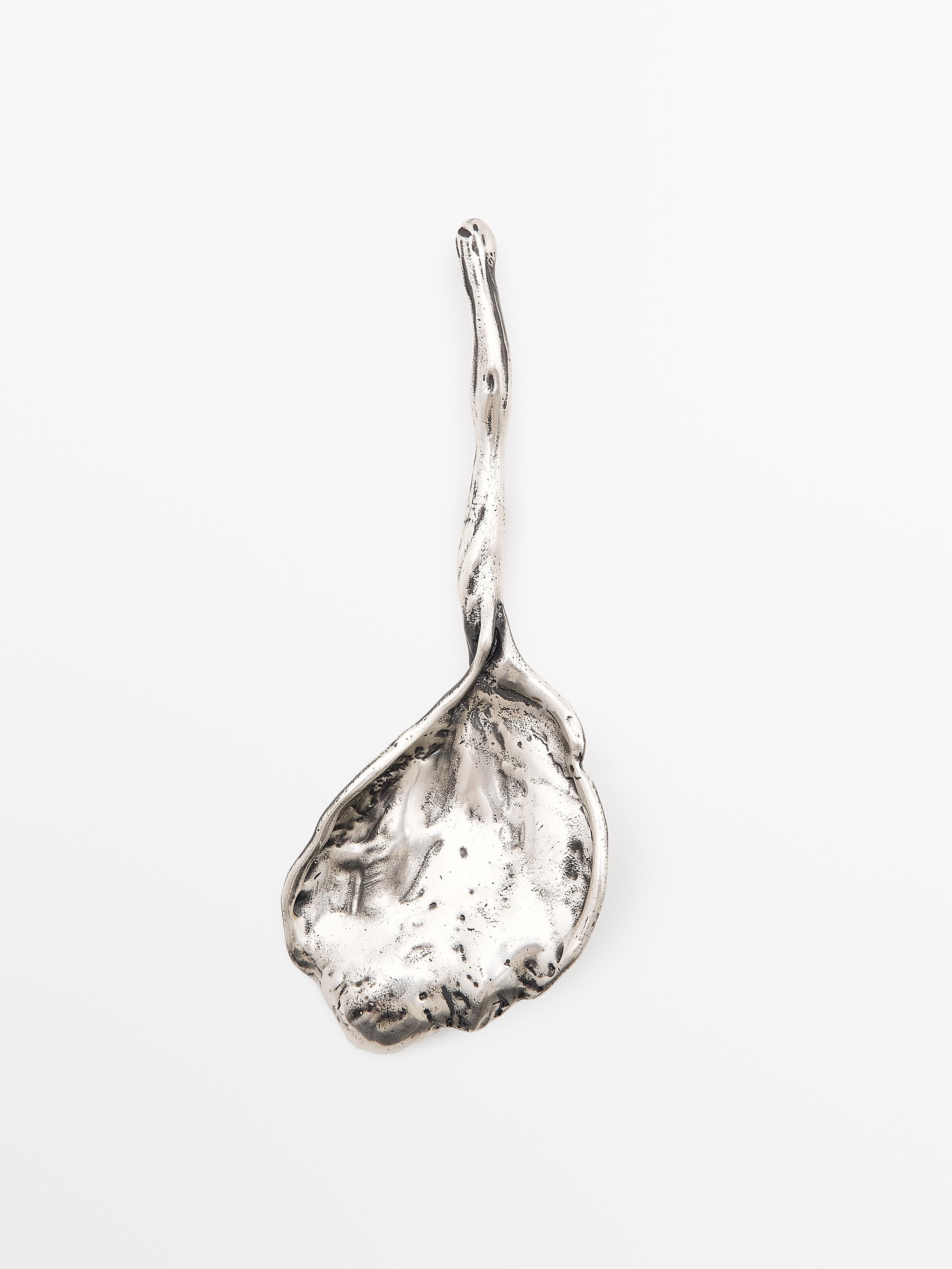 Abstrakte Metallbrosche