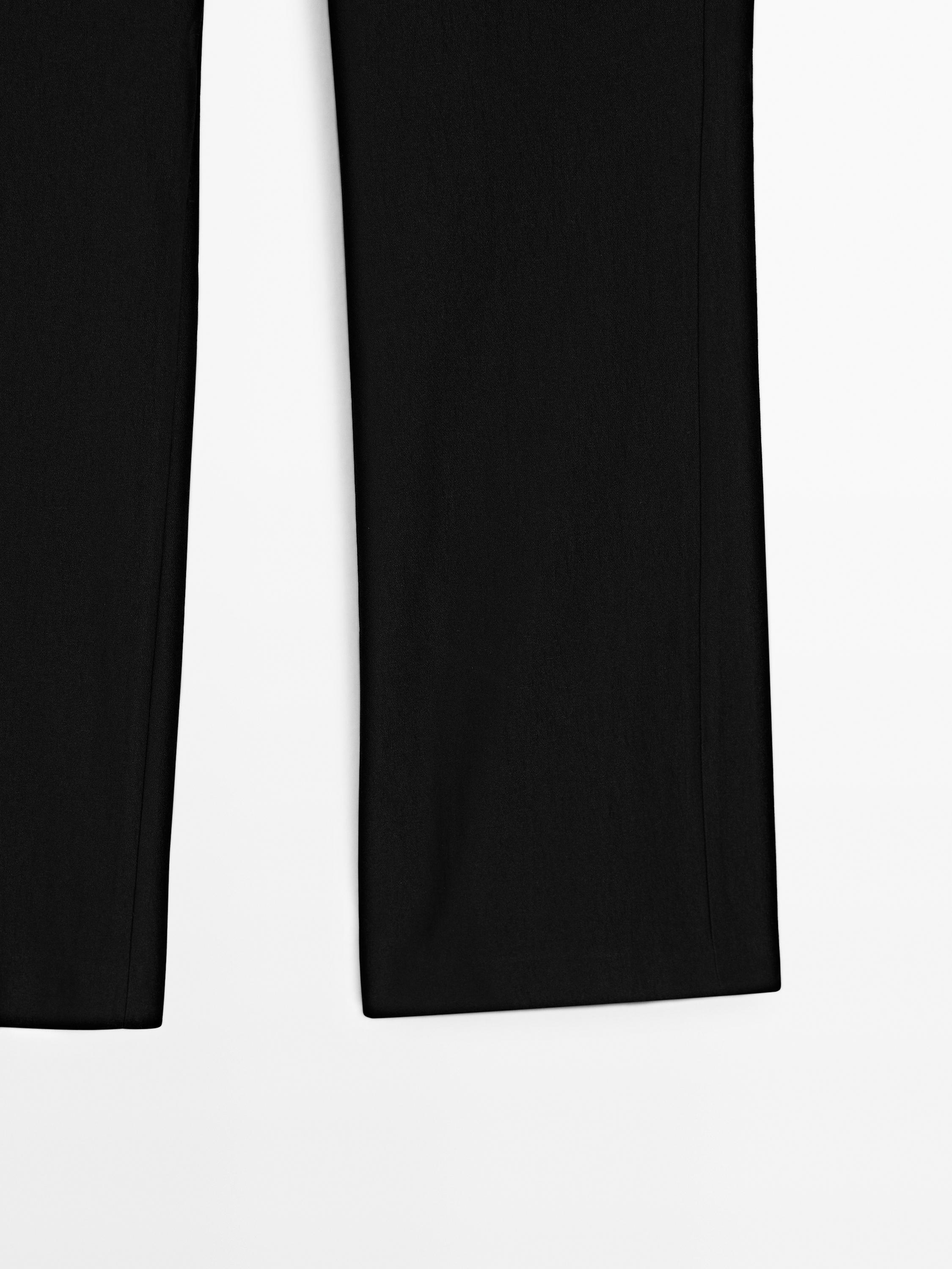 Flared trousers with waist detail