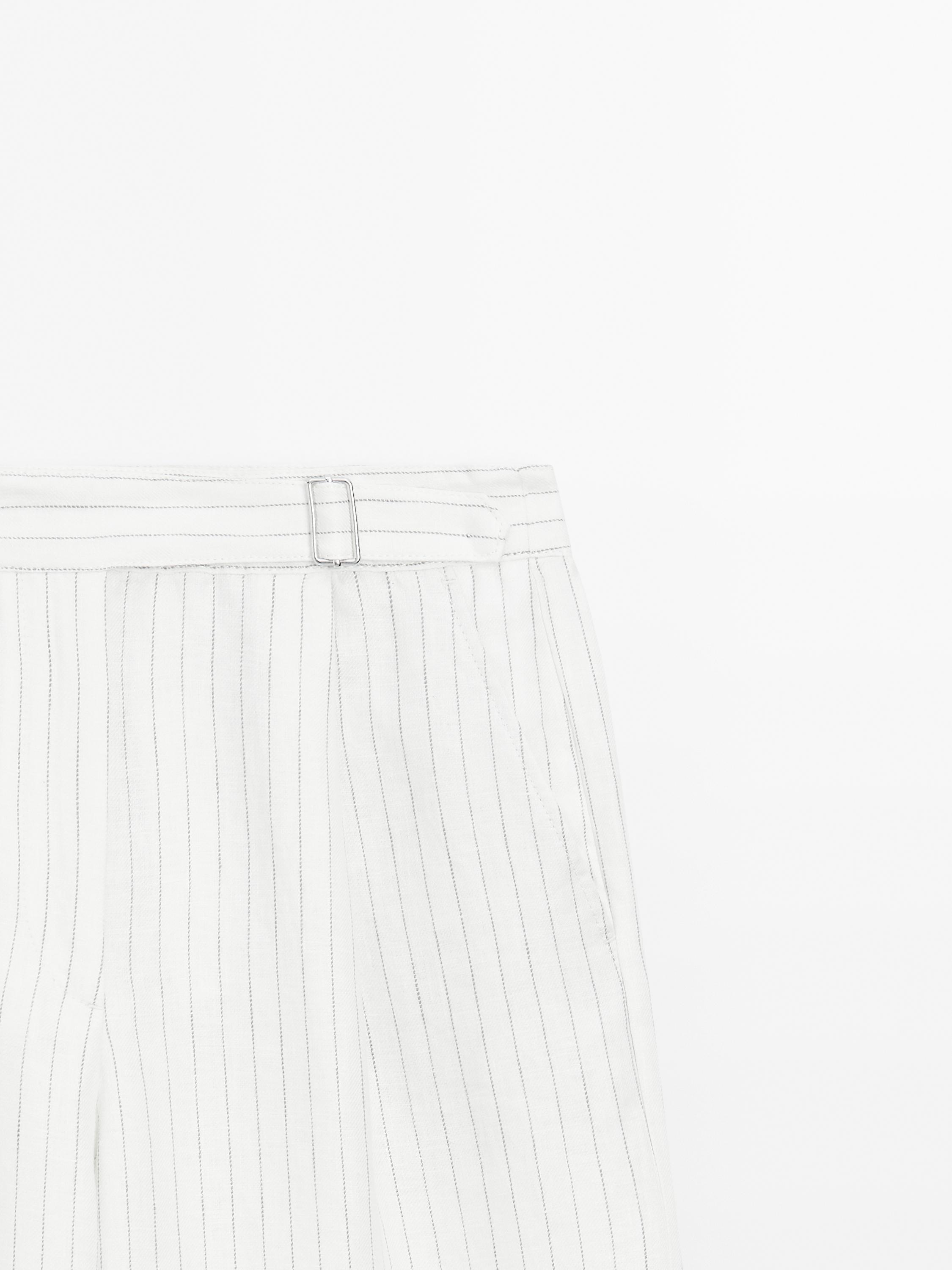 100% linen striped trousers with buckle detail