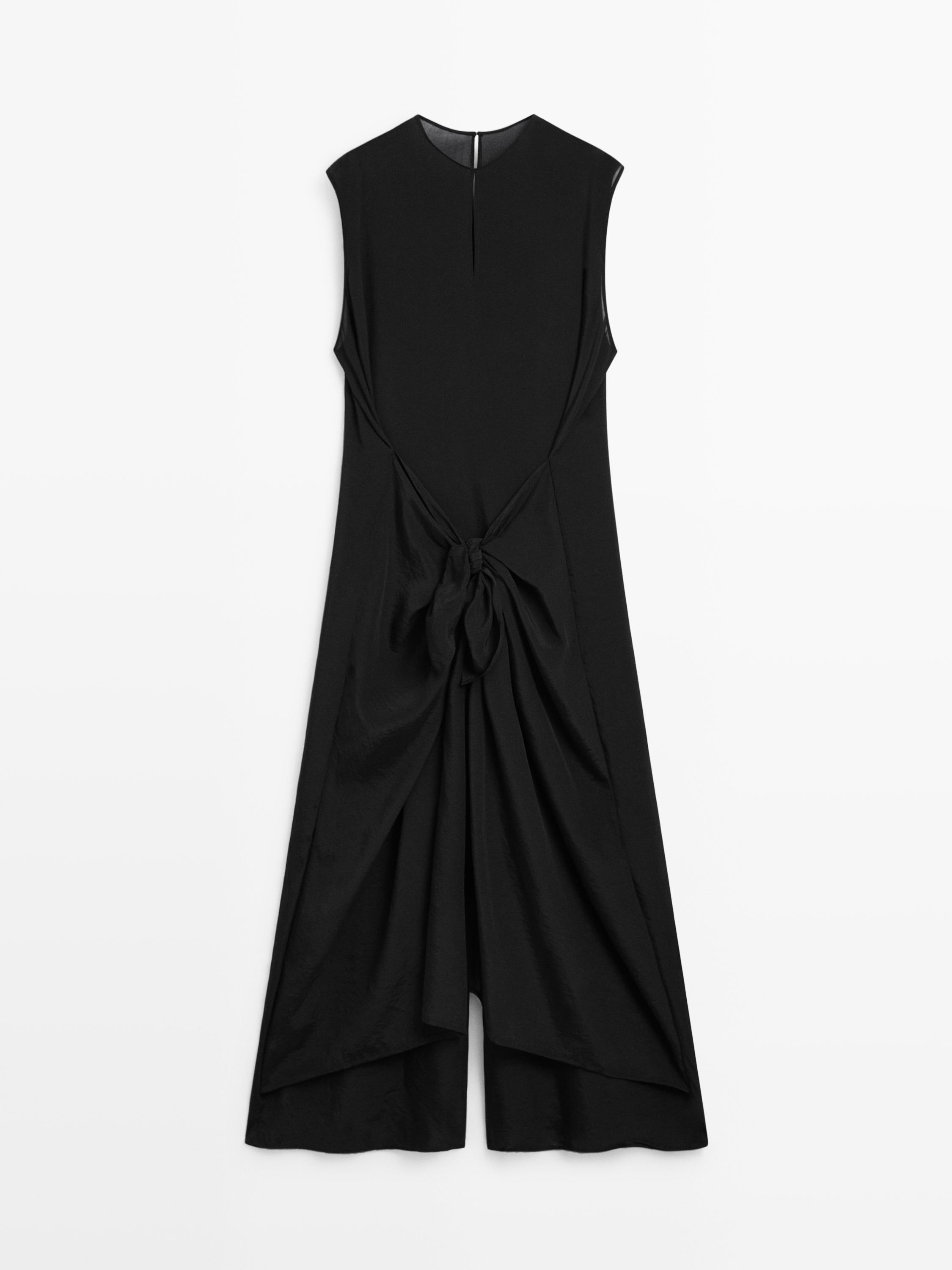 Flowing jumpsuit with knot detail