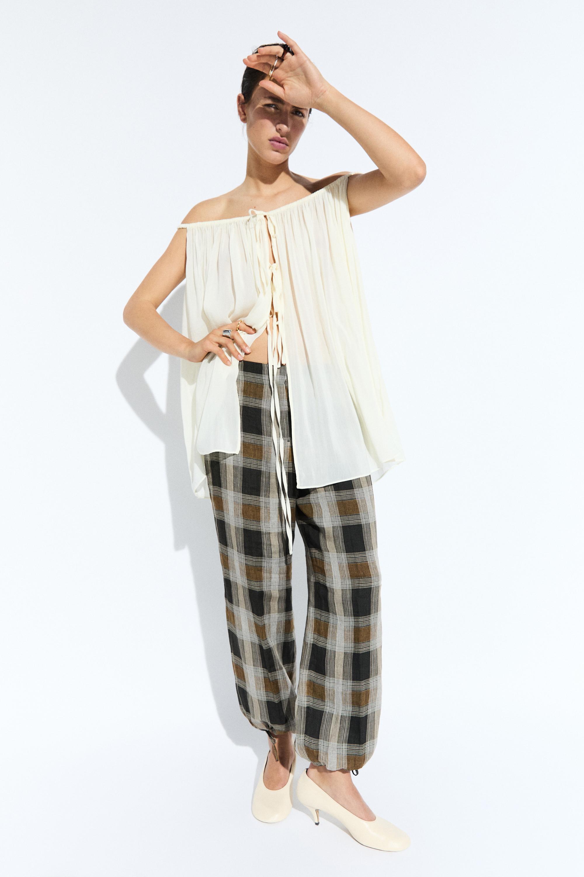 Check print sarouel trousers — BLACK