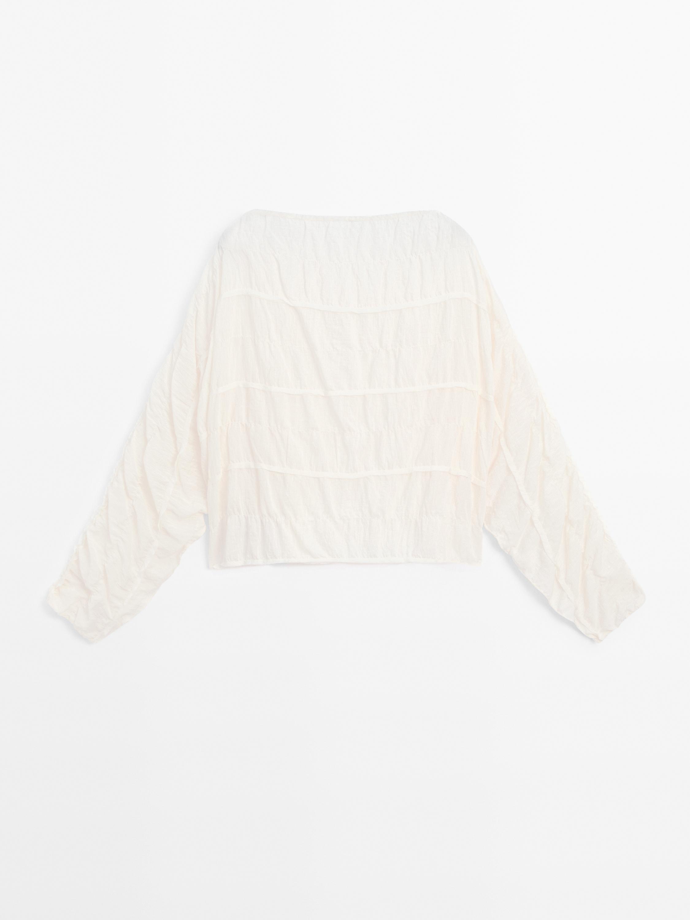 Flowing blouse with gathered detail