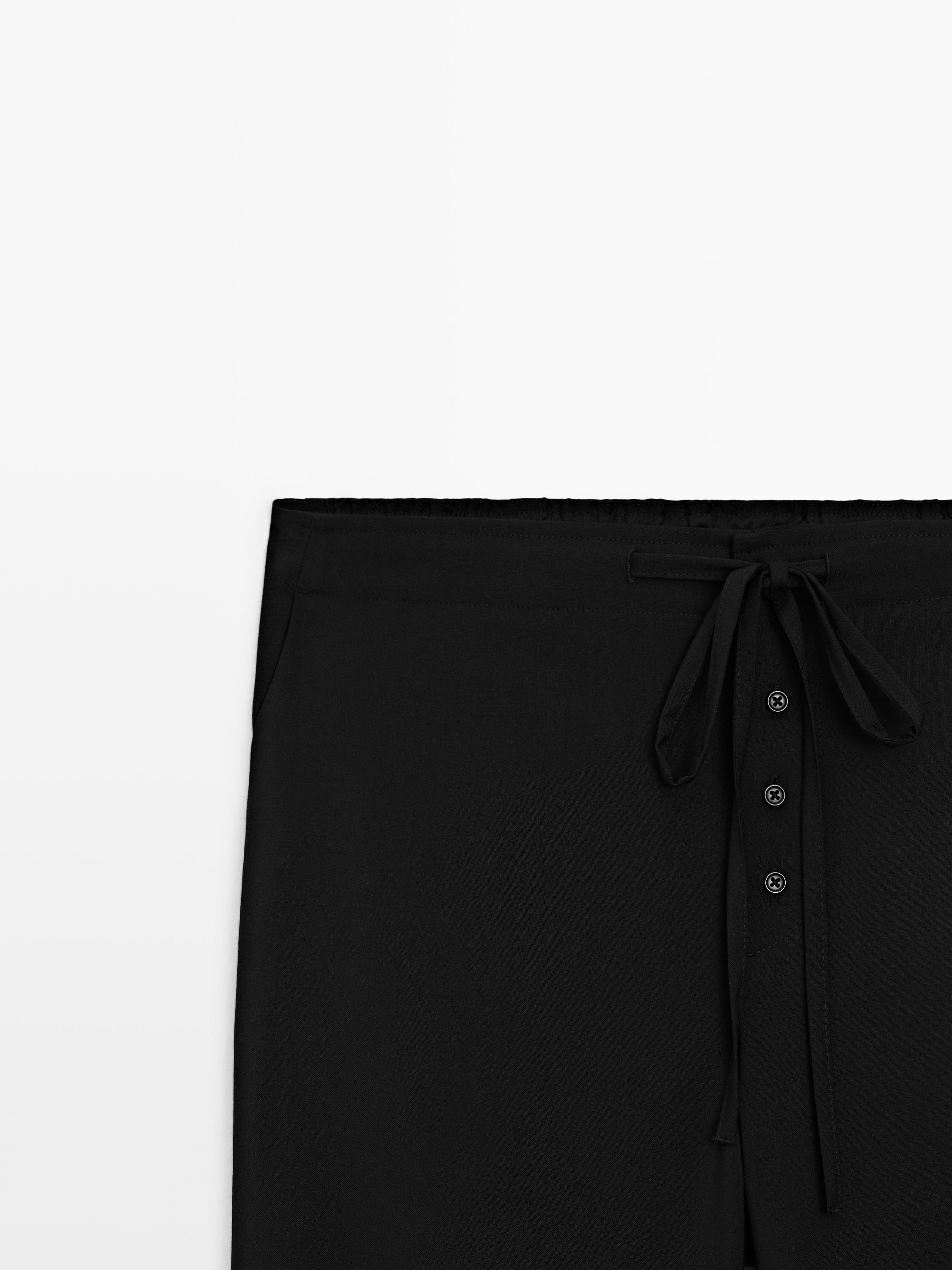 Wool sarouel trousers with tie detail — BLACK