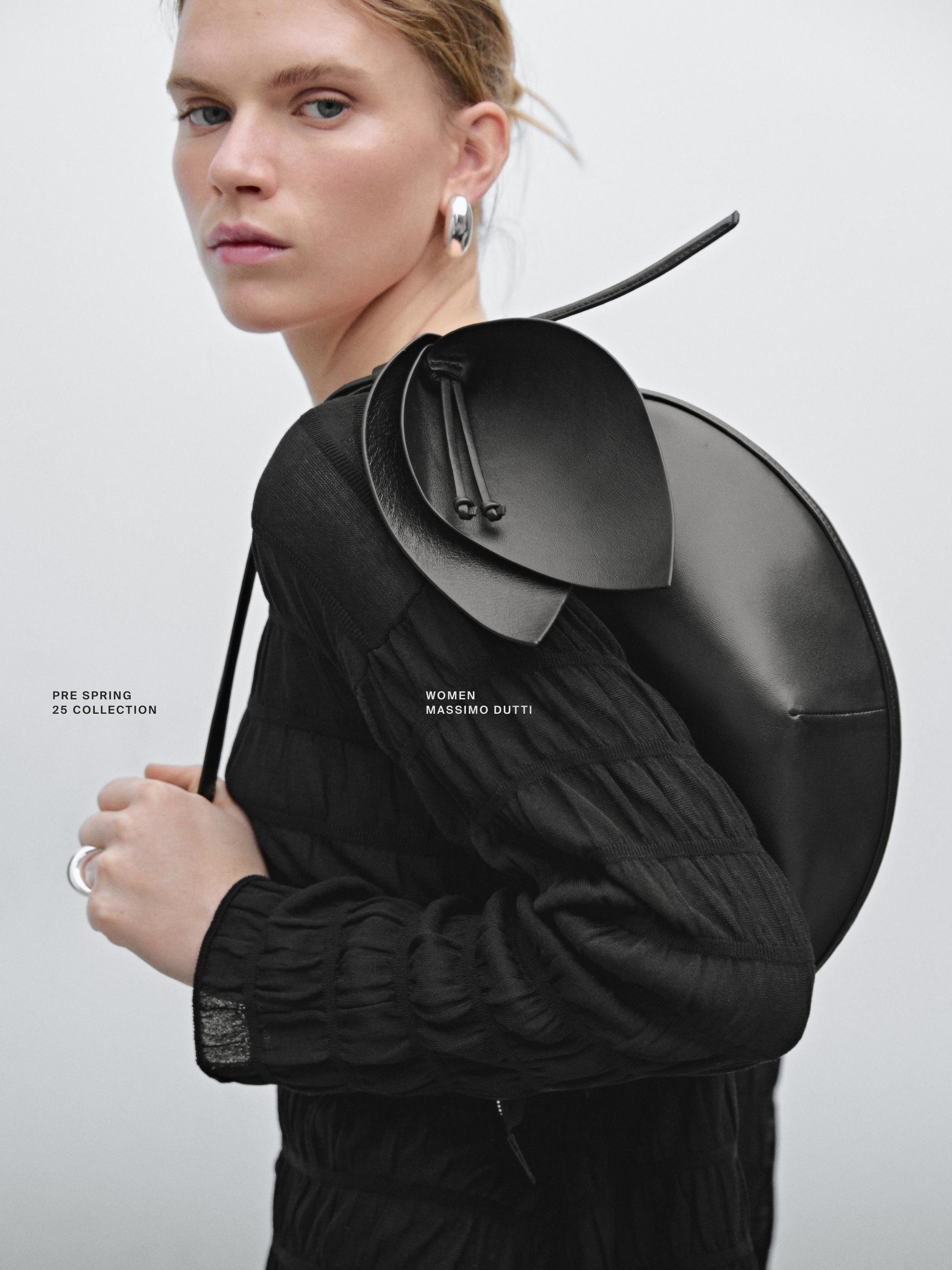 Nappa leather half-moon bag with flower detail · Black  