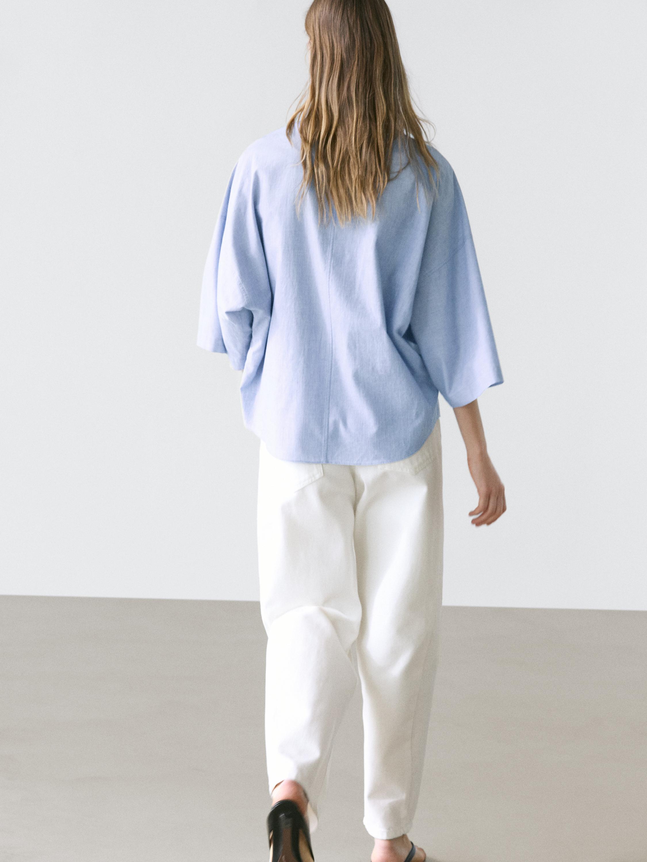 Flowing blouse with buttoned collar detail — Denim blue