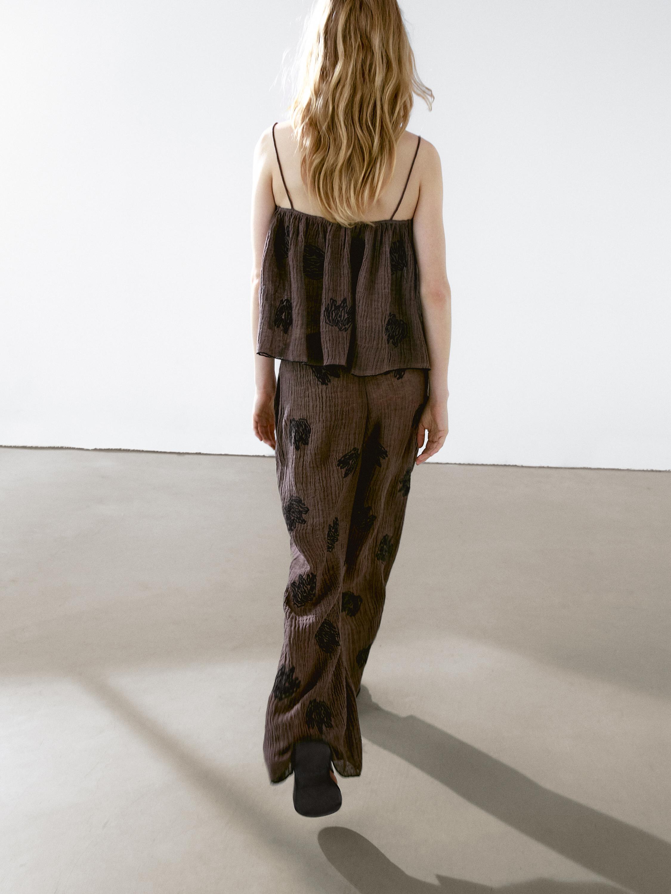 Flowing textured top with embroidered detail