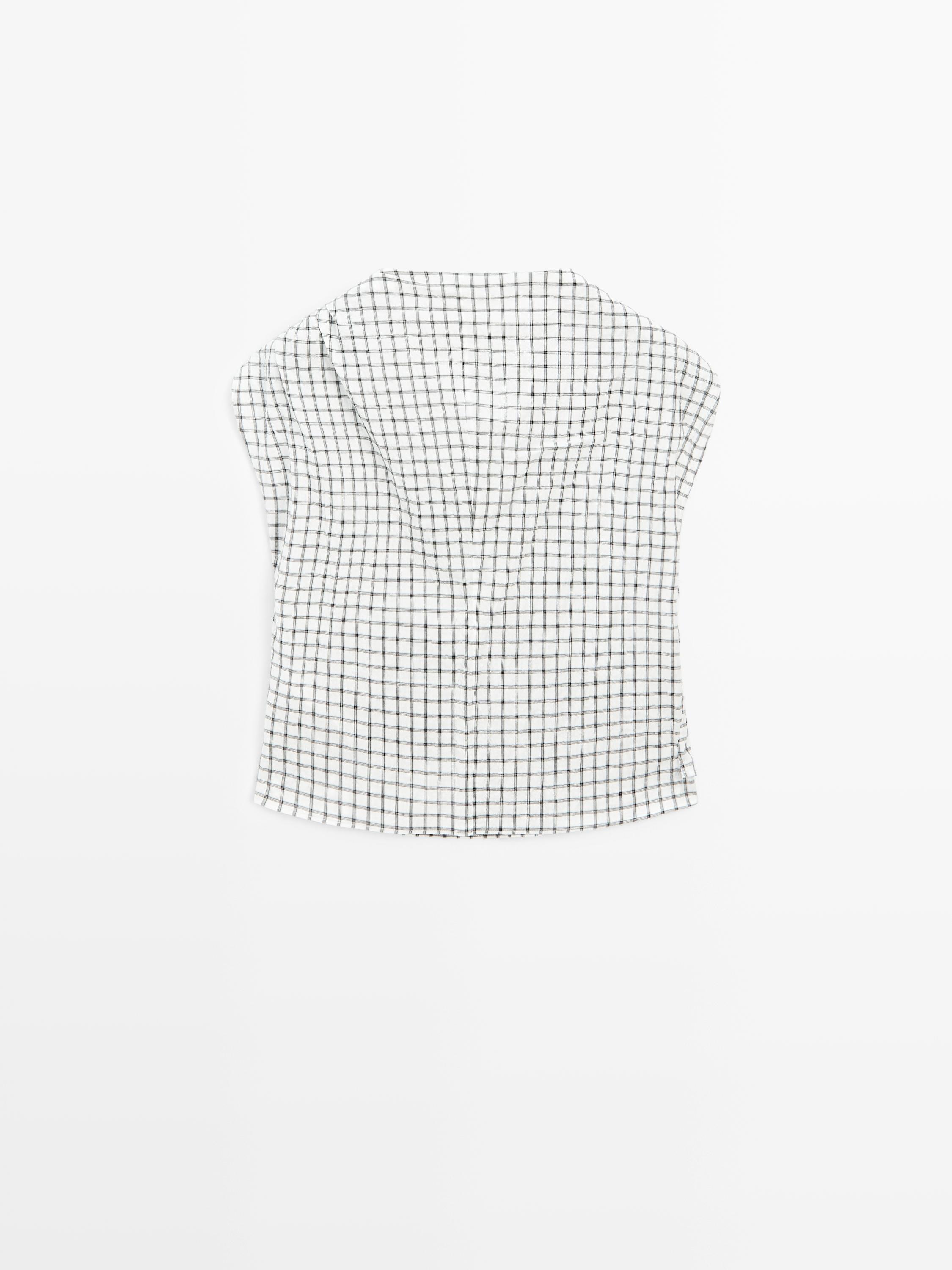 Top à carreaux et col drapé
