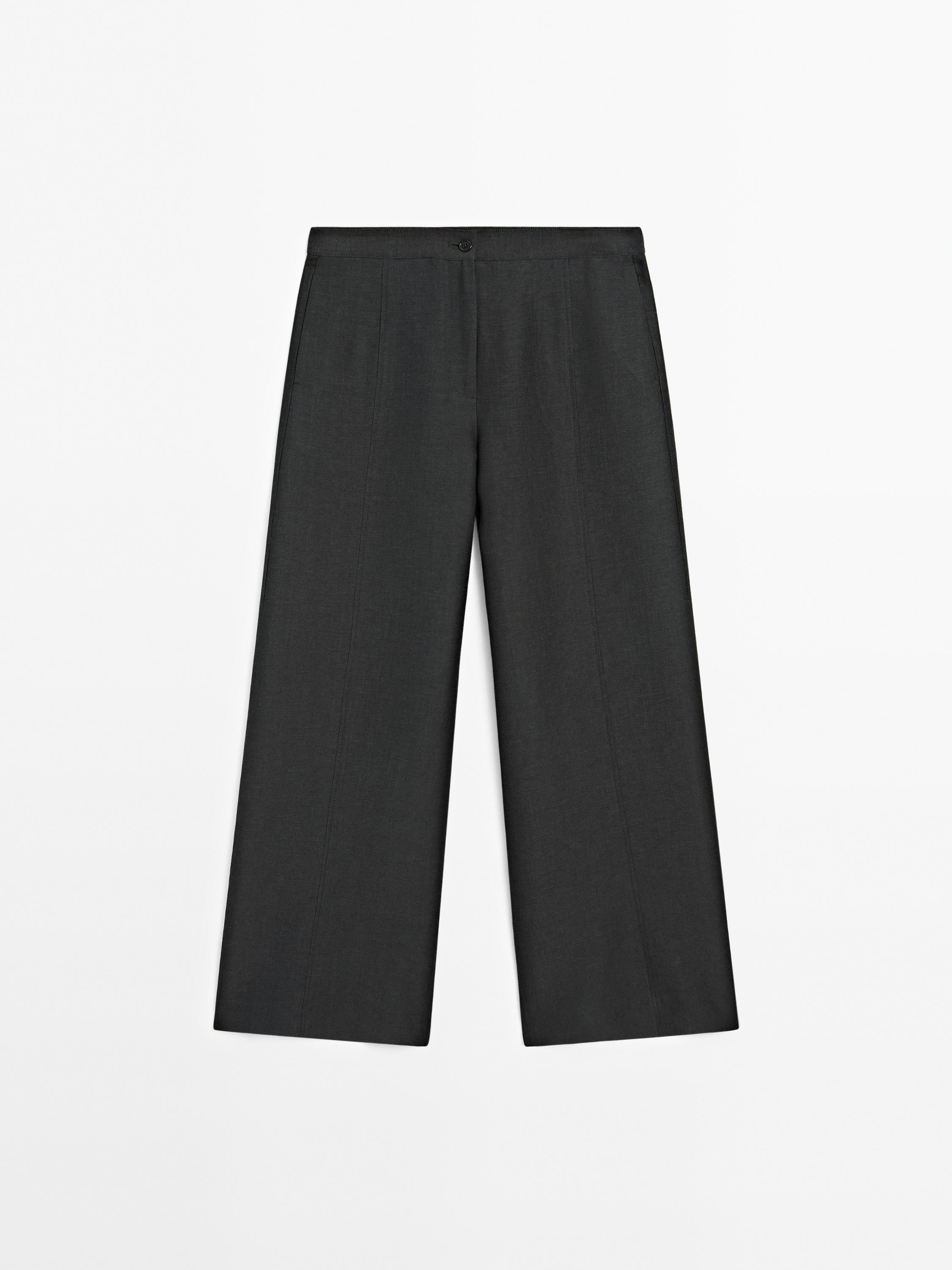 Wide fluid trousers with stitching detail