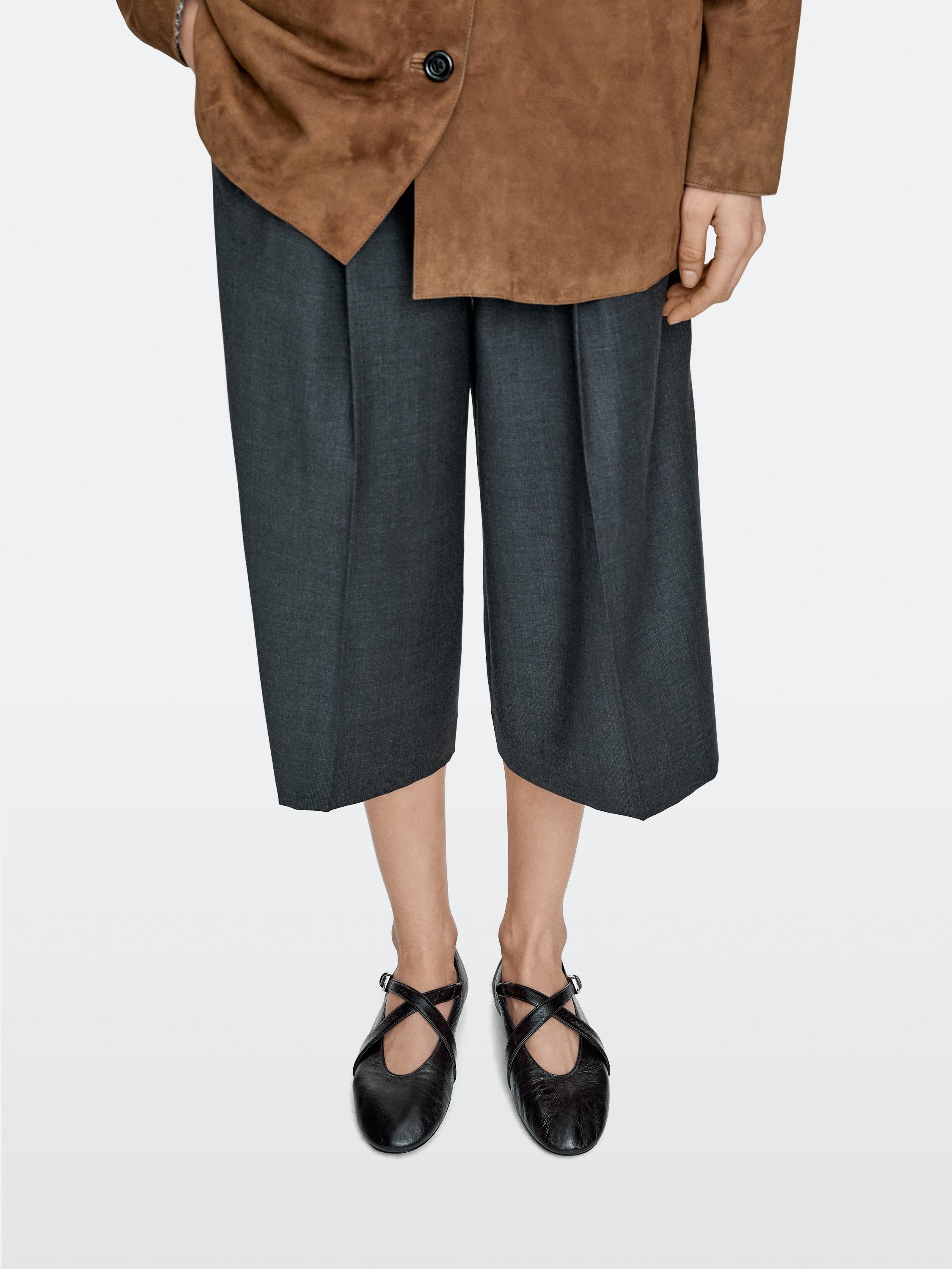 Ballet flats with criss-cross straps and buckle