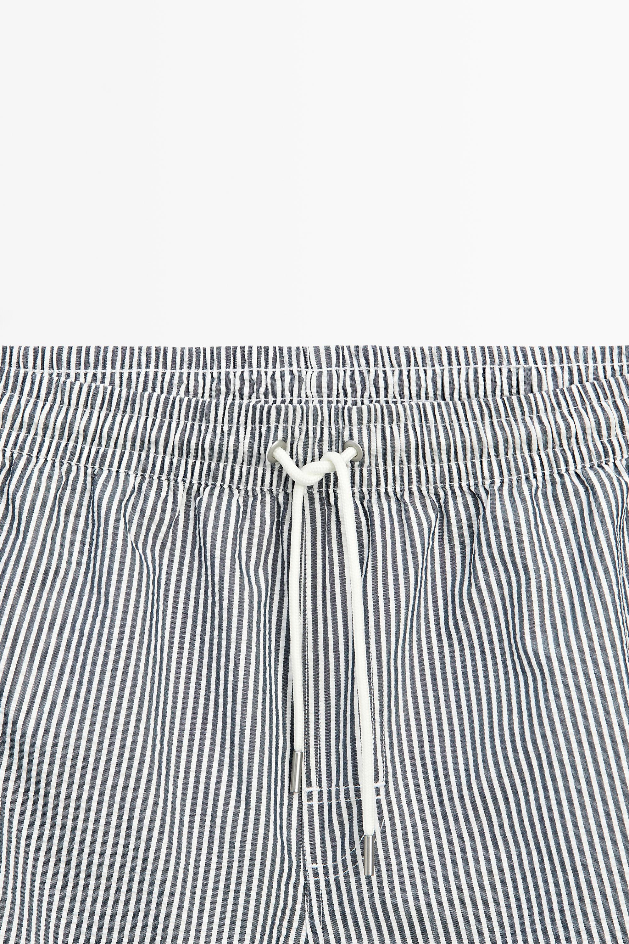 Swimming trunks with striped details — NAVY BLUE
