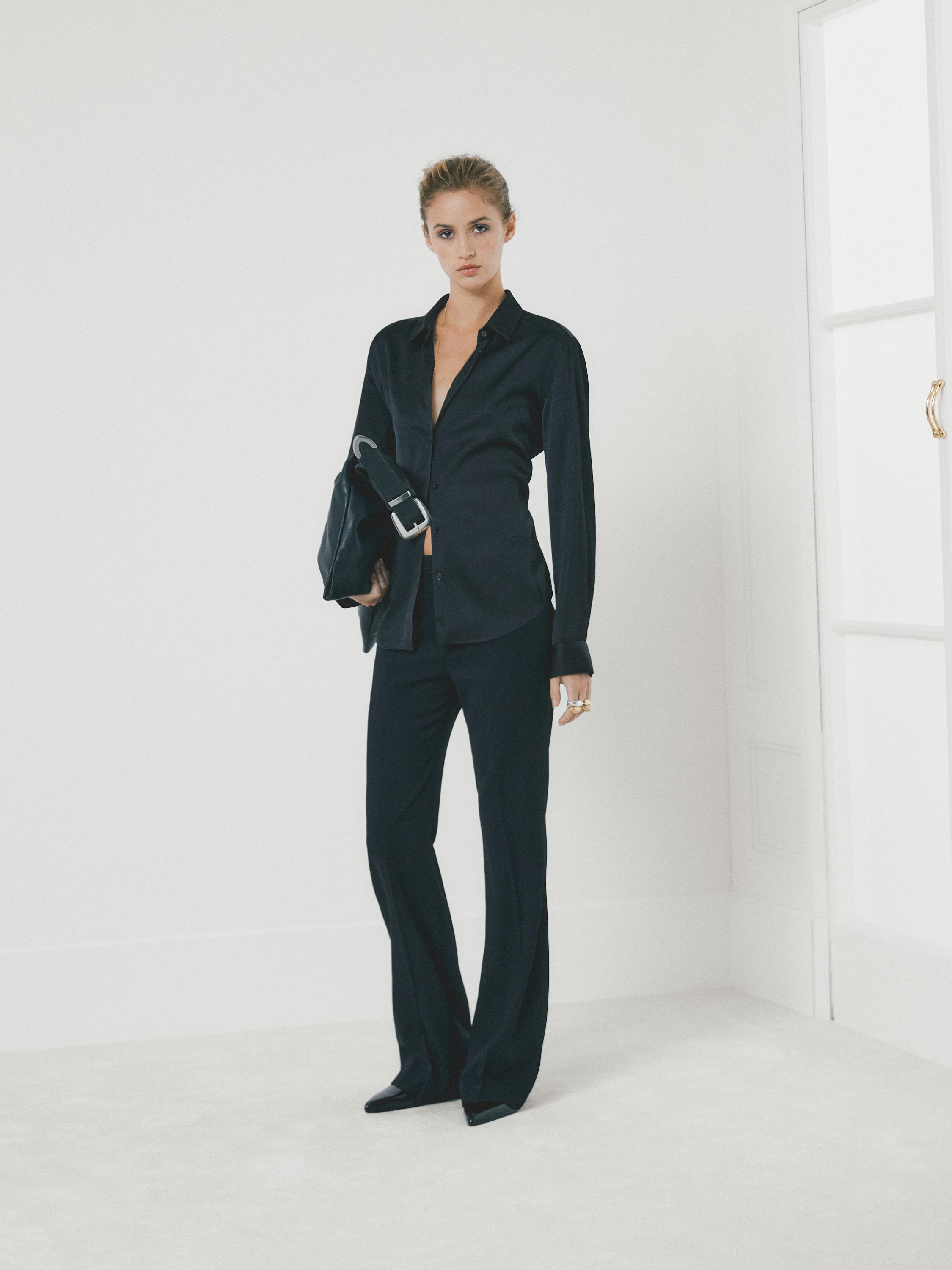 Flared trousers with pocket — BLACK