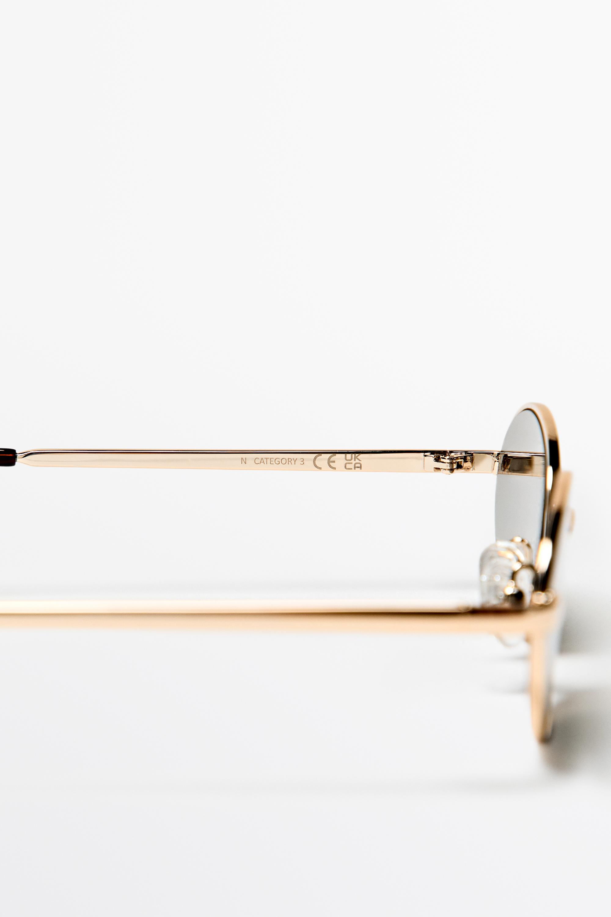 Oval metal sunglasses — GOLDEN