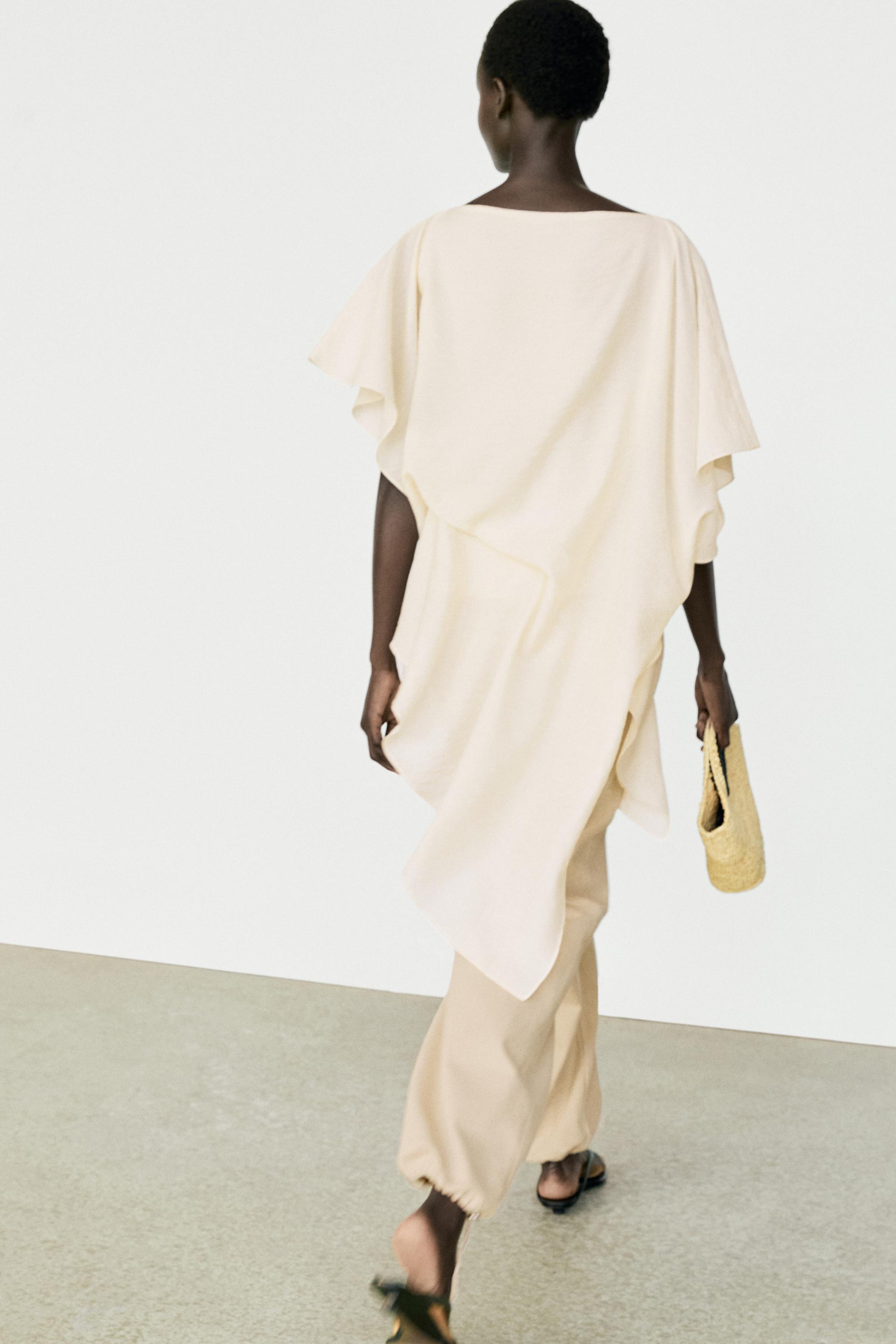 Asymmetric cape-style flowing blouse — Off white