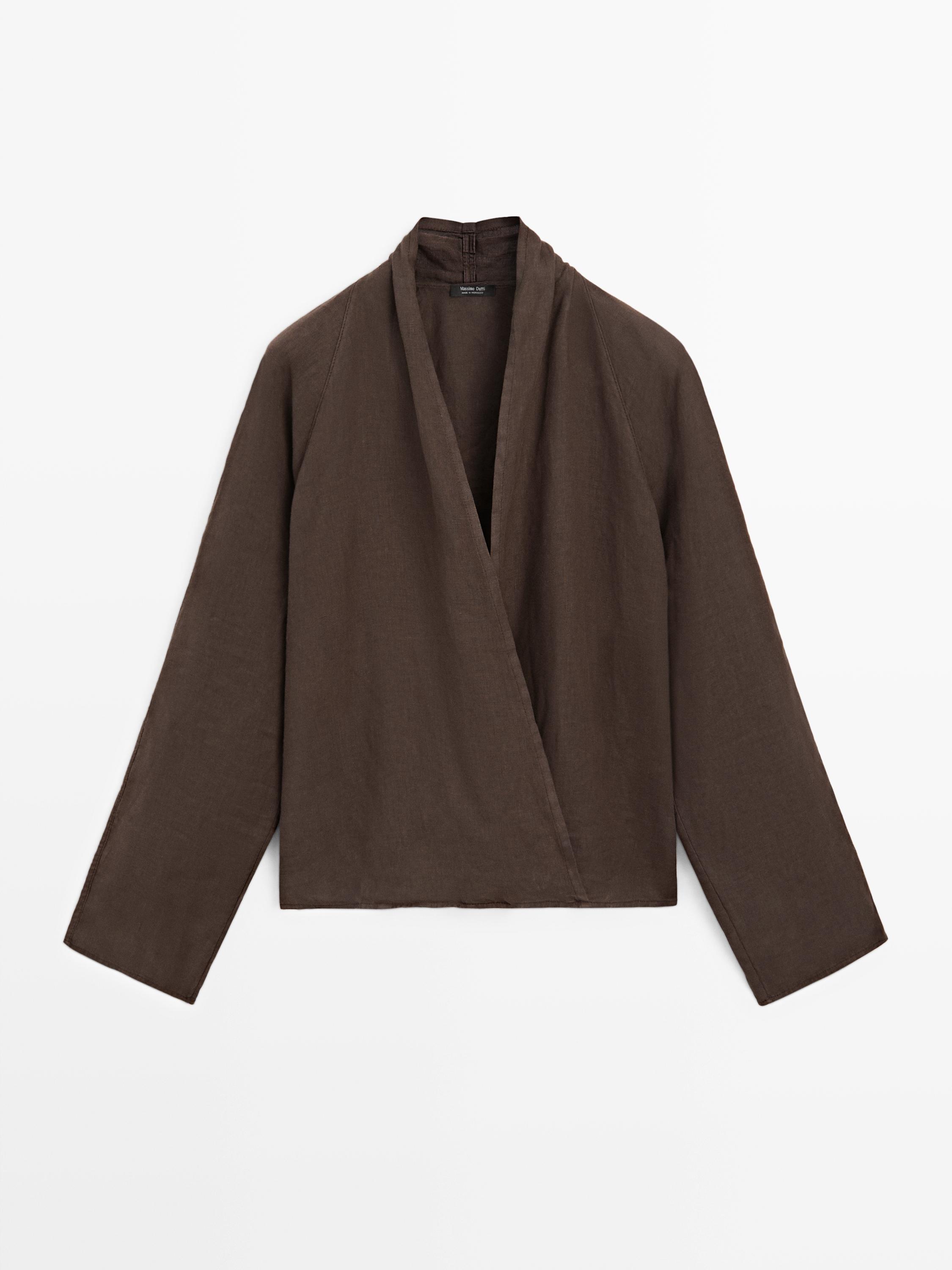 Front view of a brown wrap blouse with a V-neck and long sleeves.