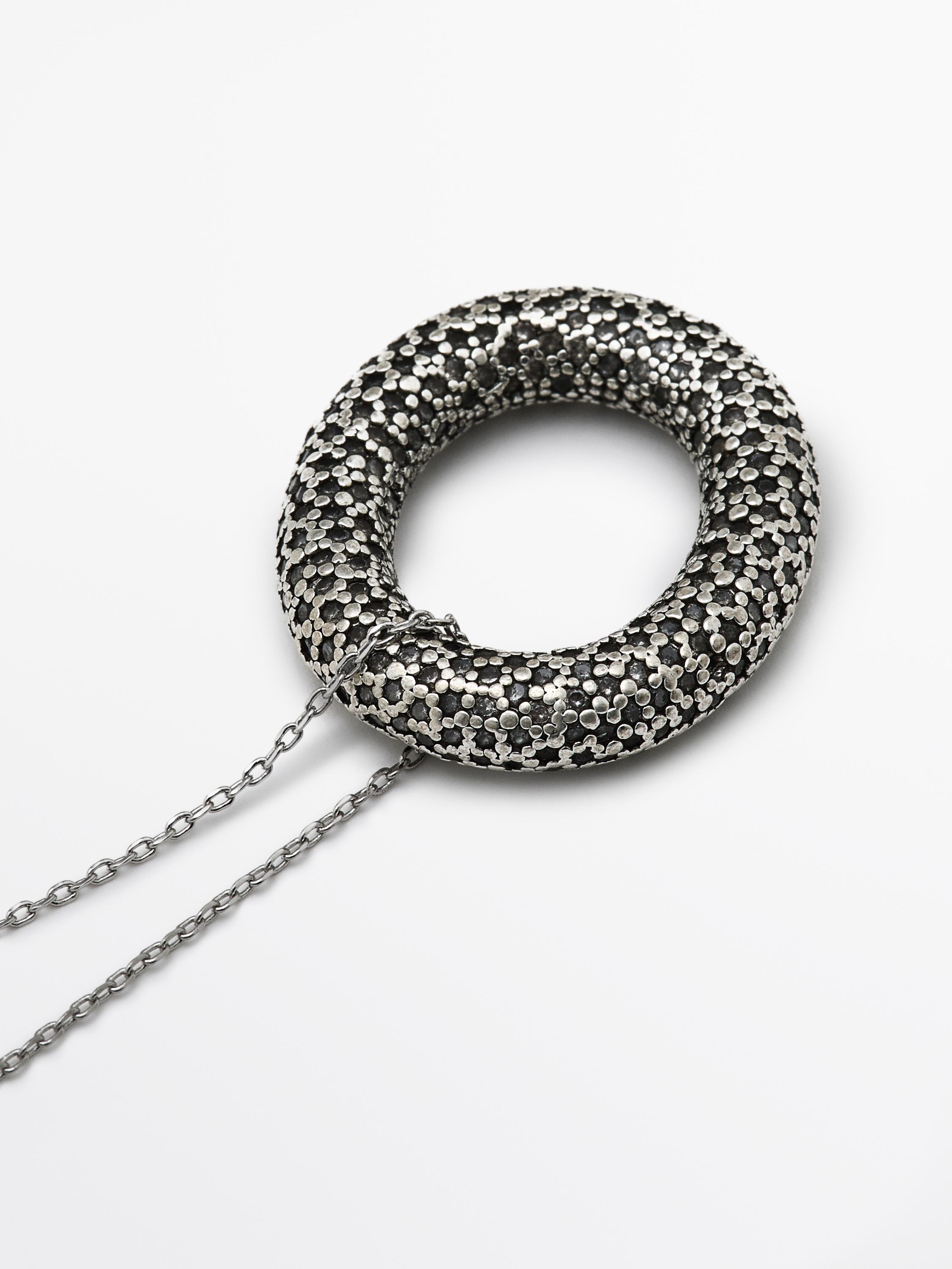 Necklace with rhinestone textured piece
