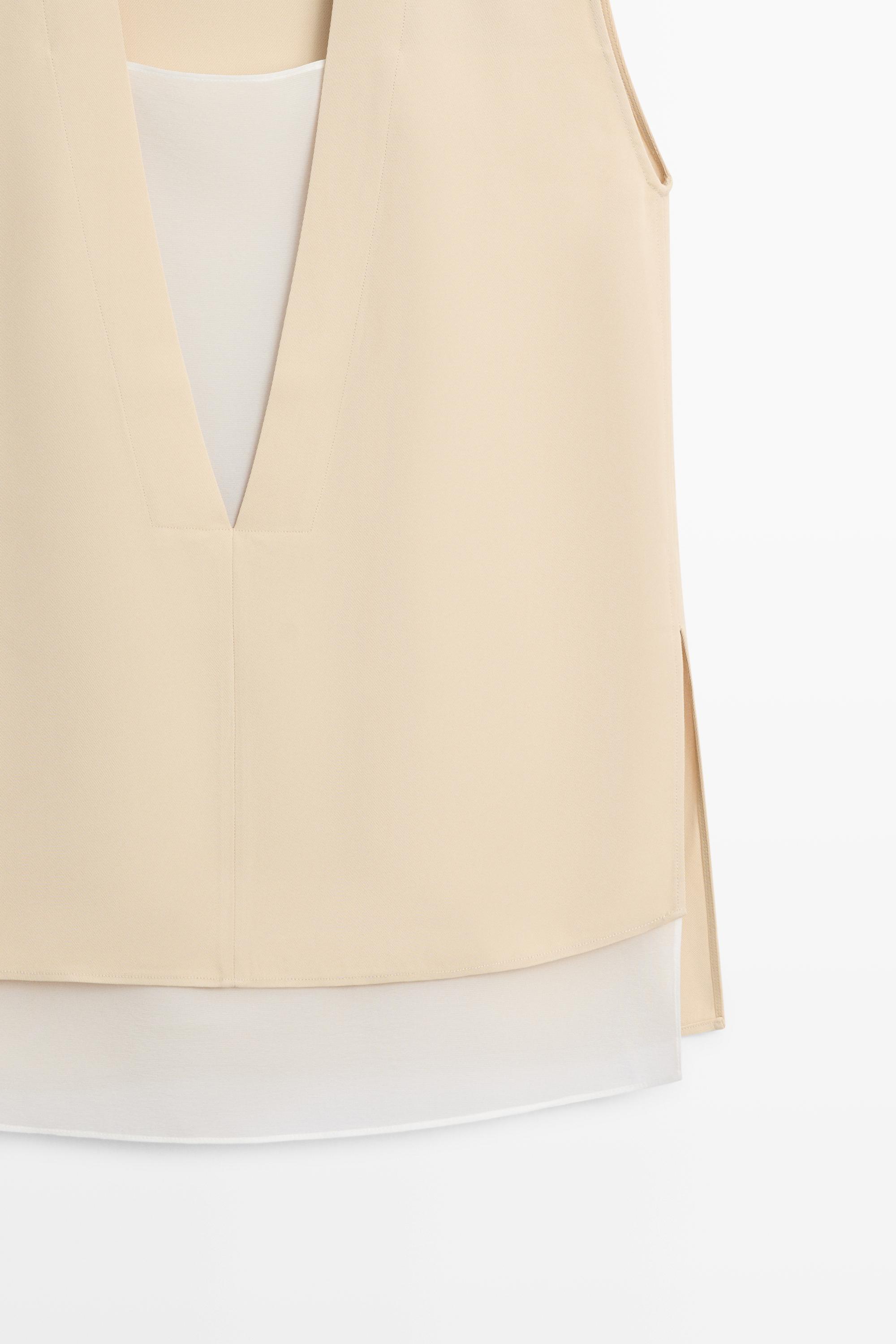 Flowing double-layer top with contrast detail — CREAM