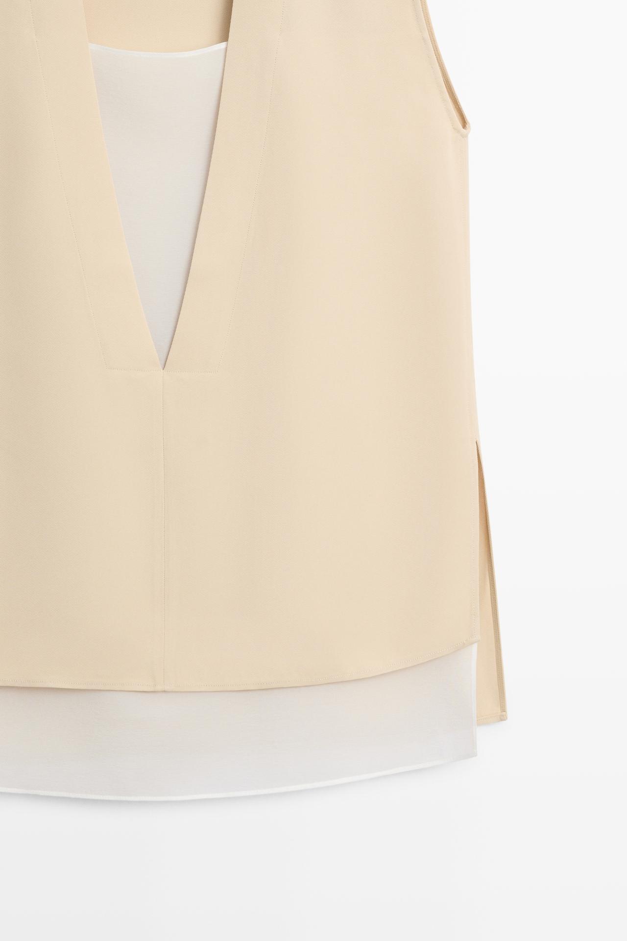 Flowing double-layer top with contrast detail — CREAM