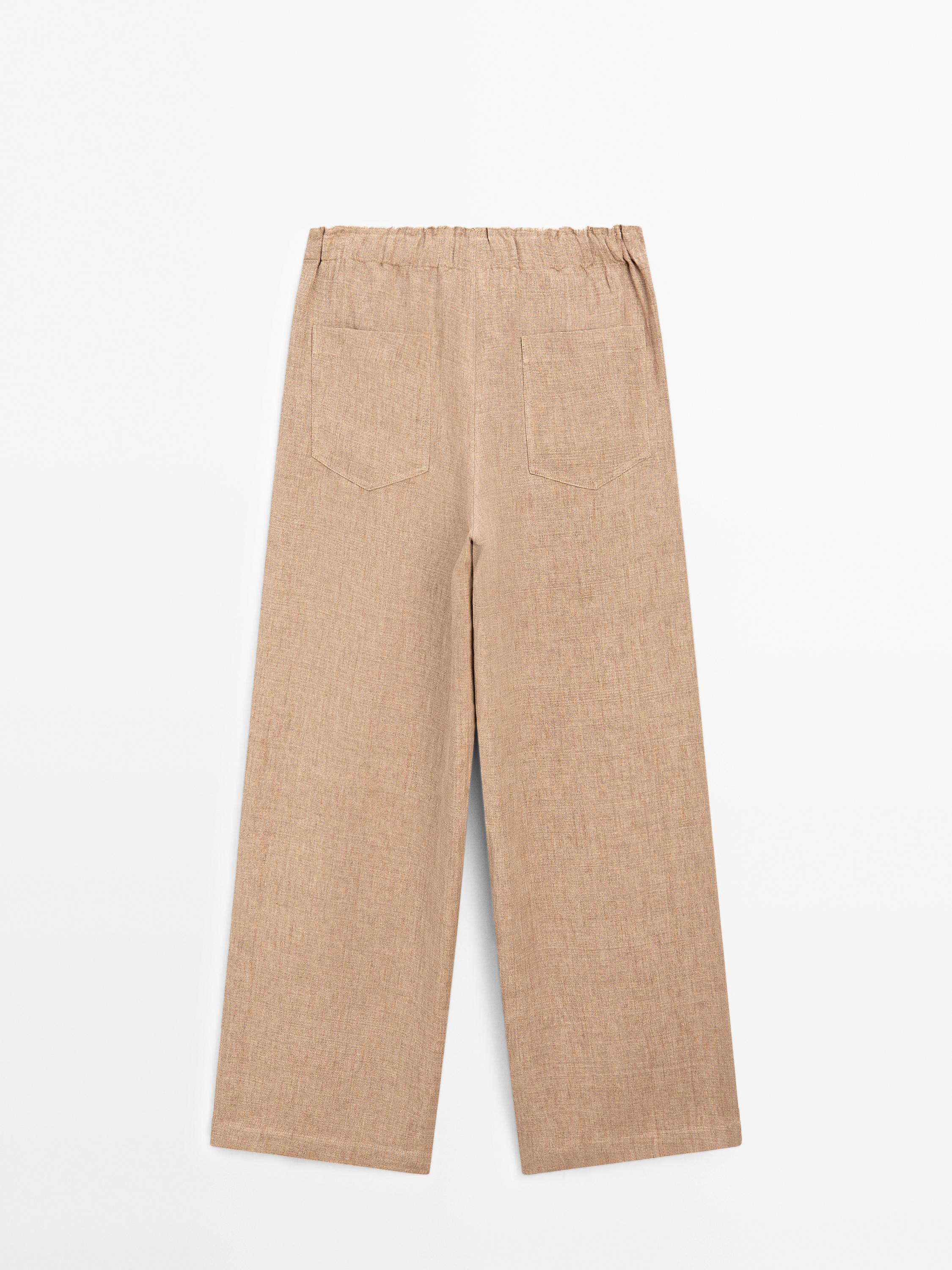Linen suit trousers with frayed detail