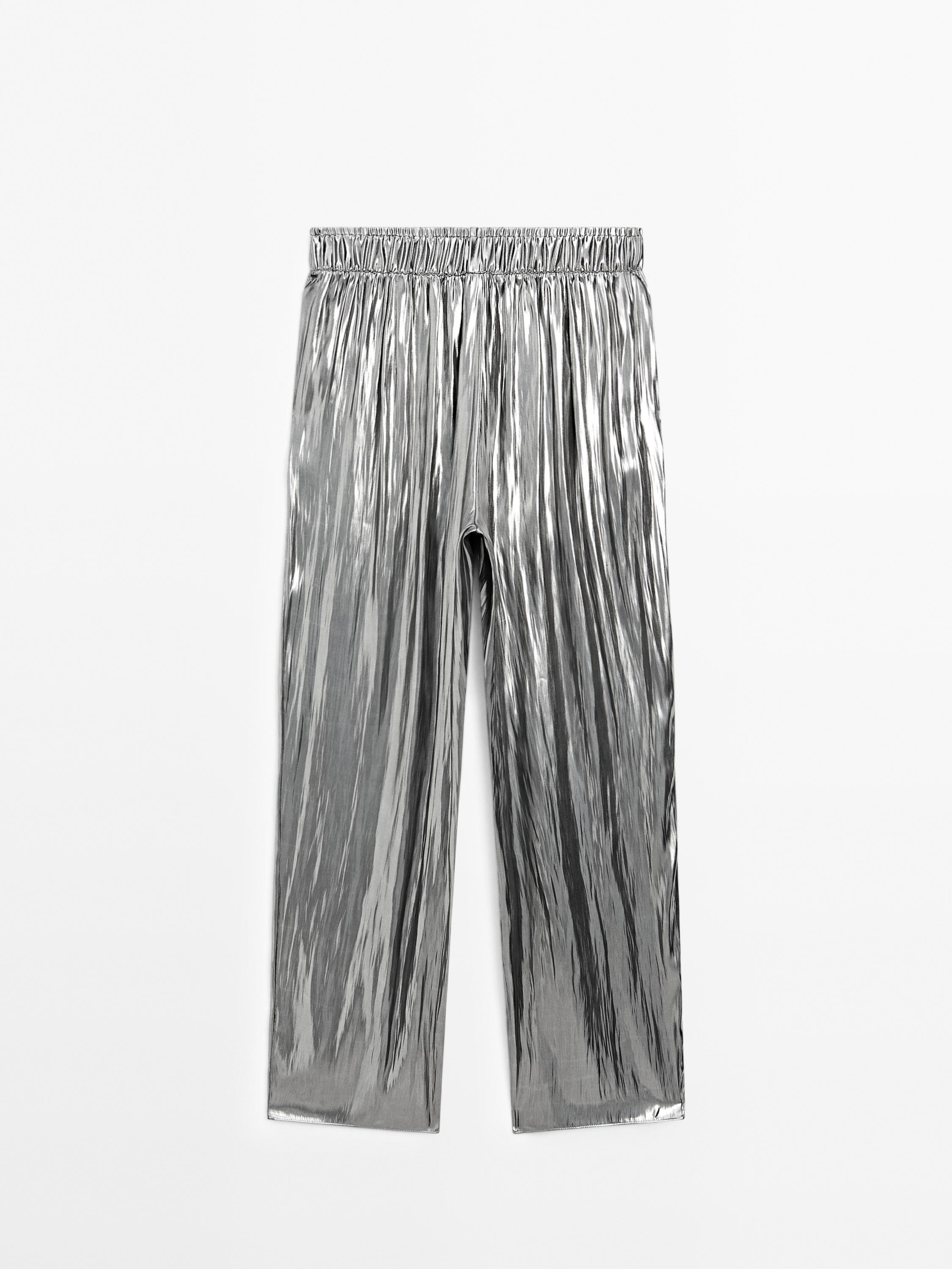 Flowing metallic trousers with gathered detail