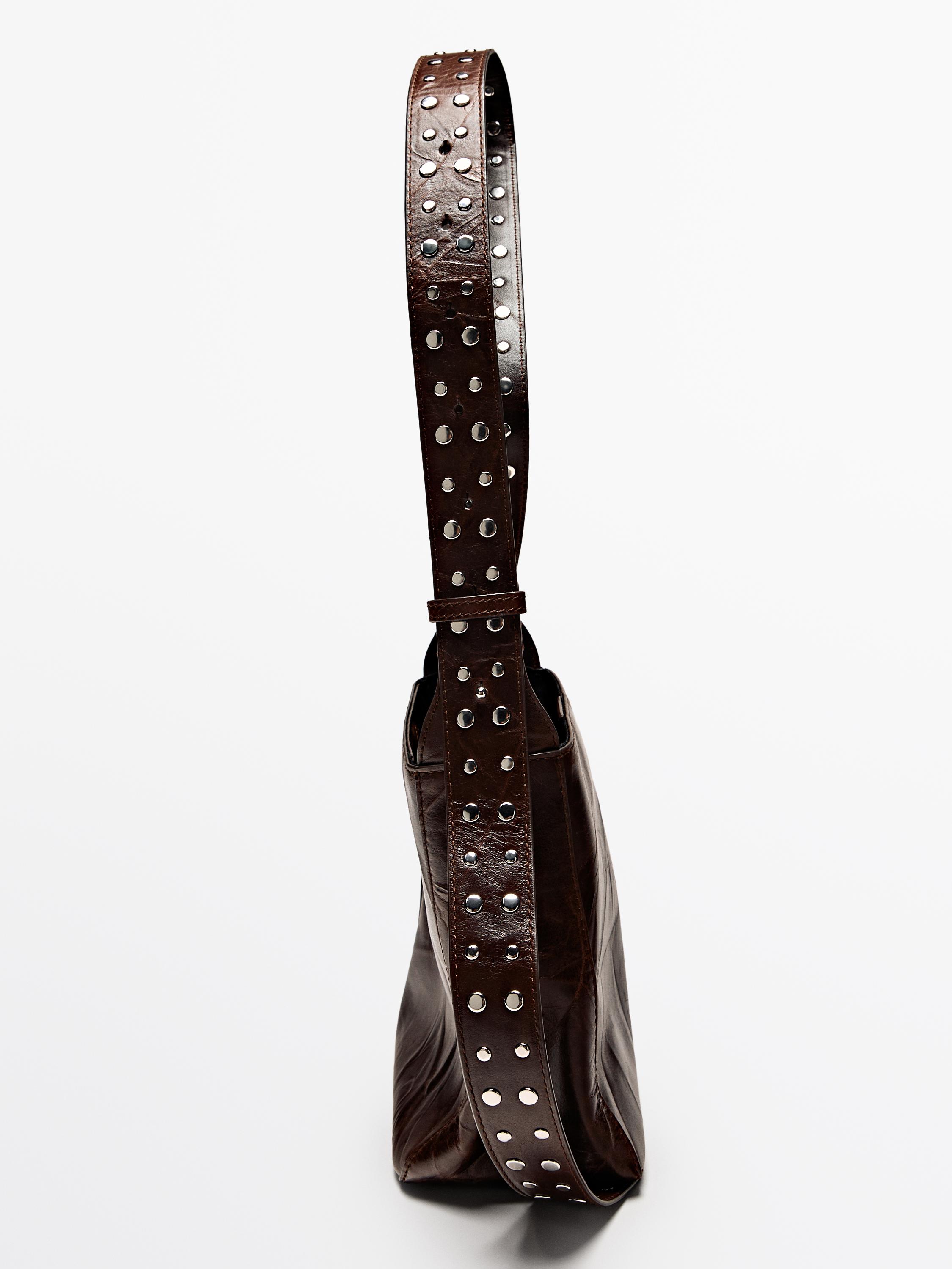 Nappa leather bucket bag with studs