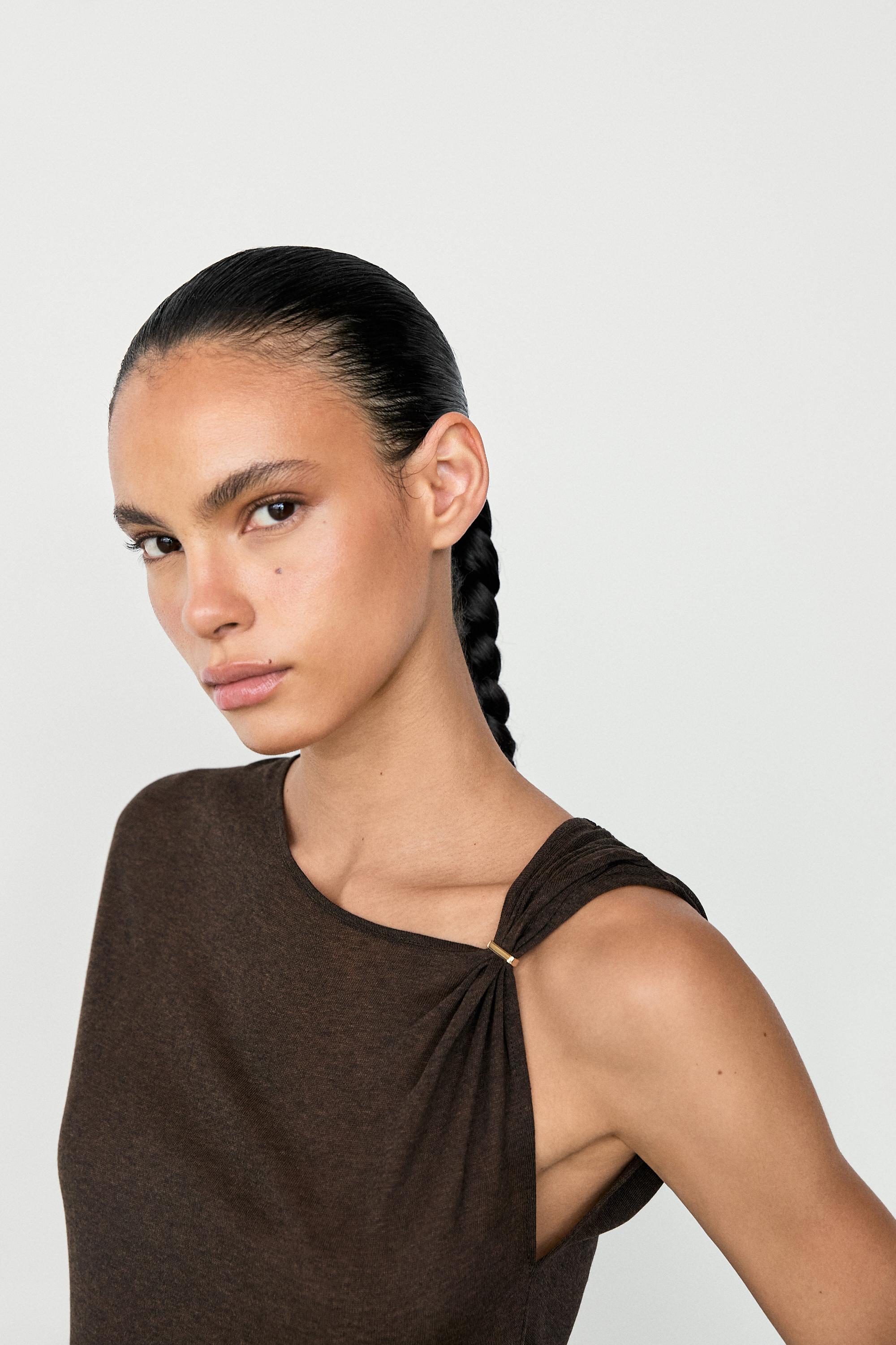 Asymmetric drop sleeve fluid top — BROWN MARL
