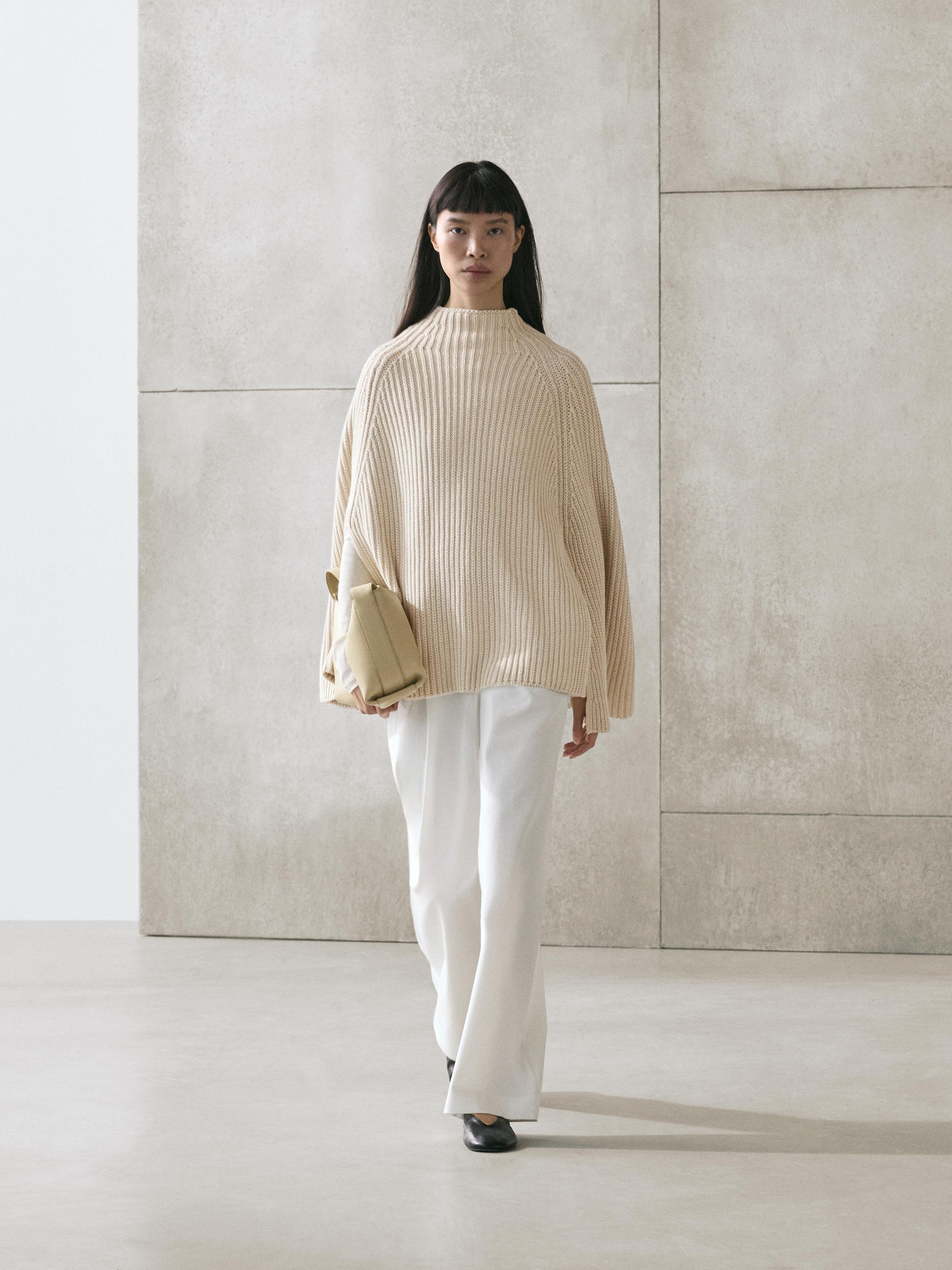 Tricot cape met split