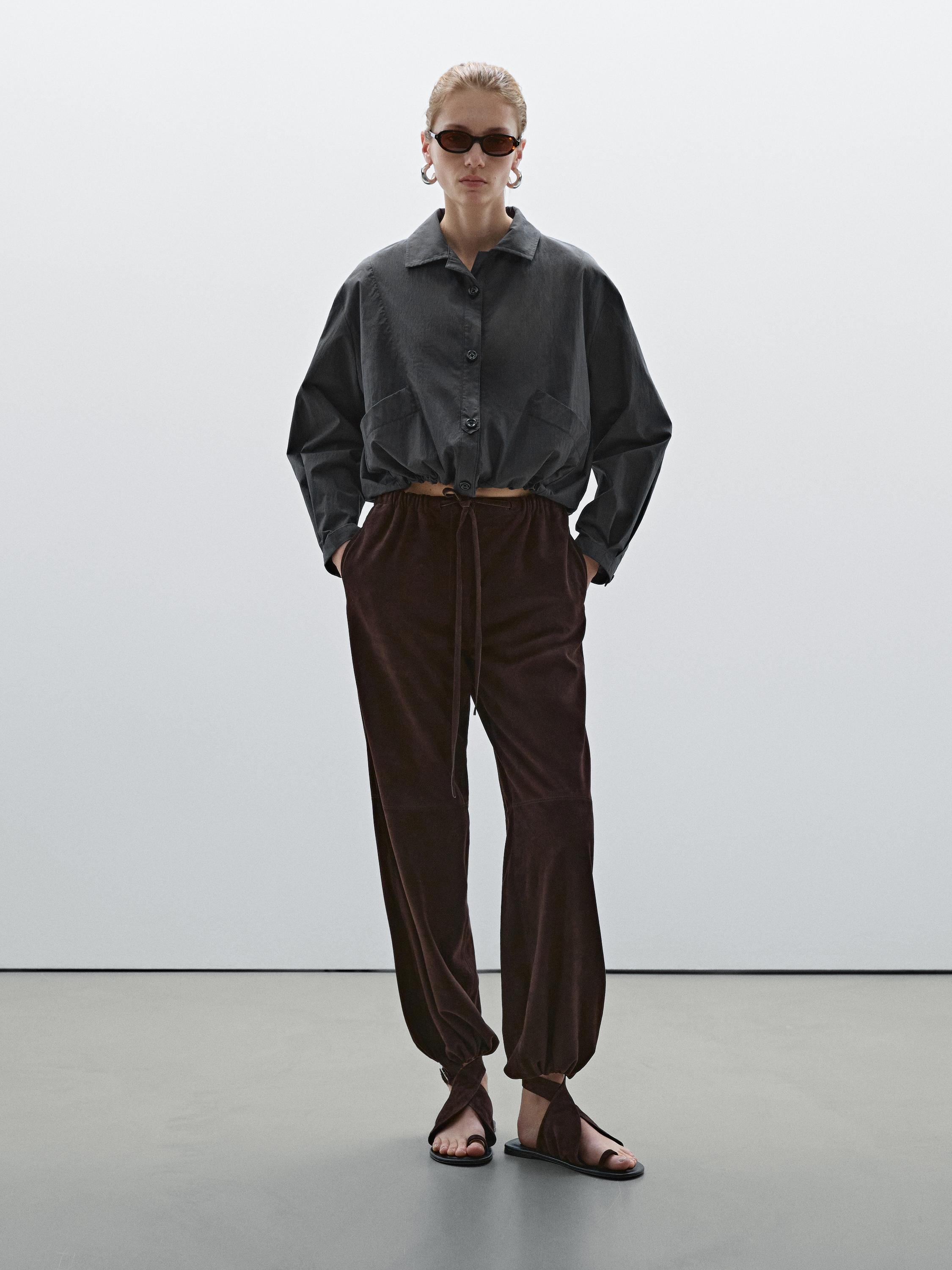 Bomber jacket with seams and gathering
