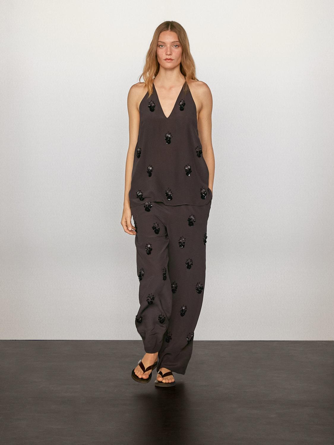 Pantalon fluide à fleurs appliquées