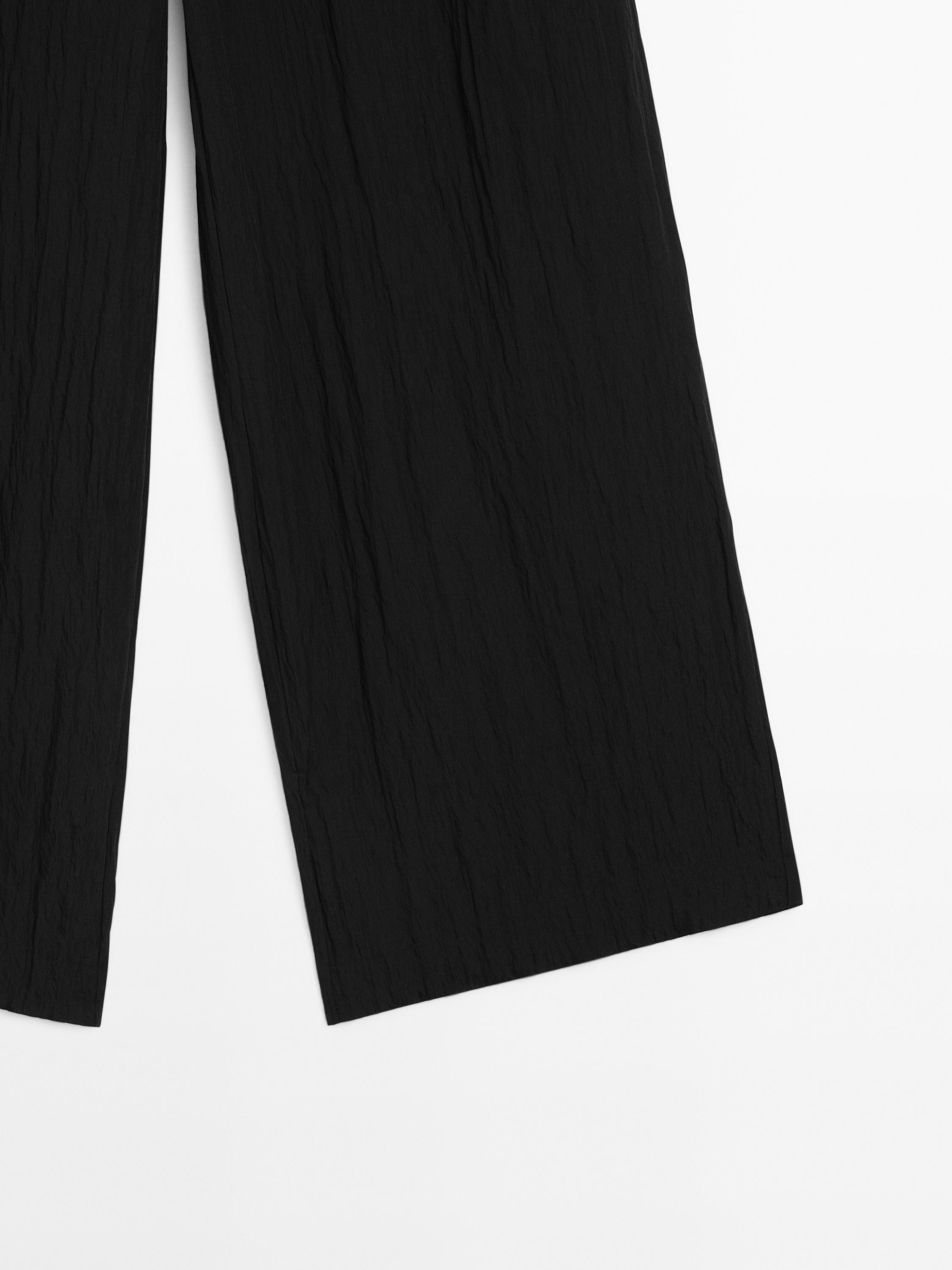 Technical trousers with darts