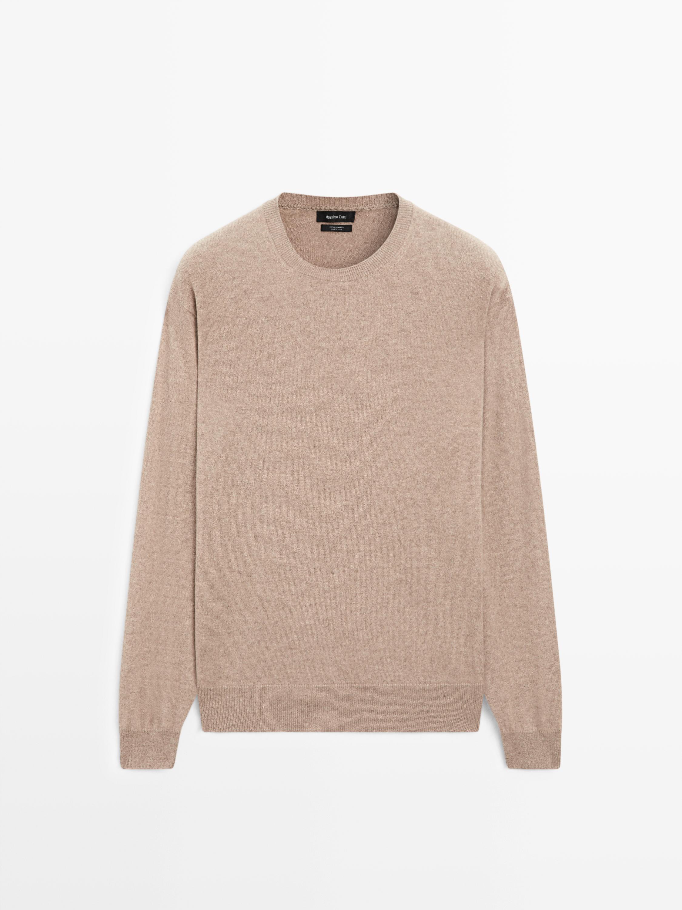 Front view of a knitted mink jersey with a round neck and long sleeves.