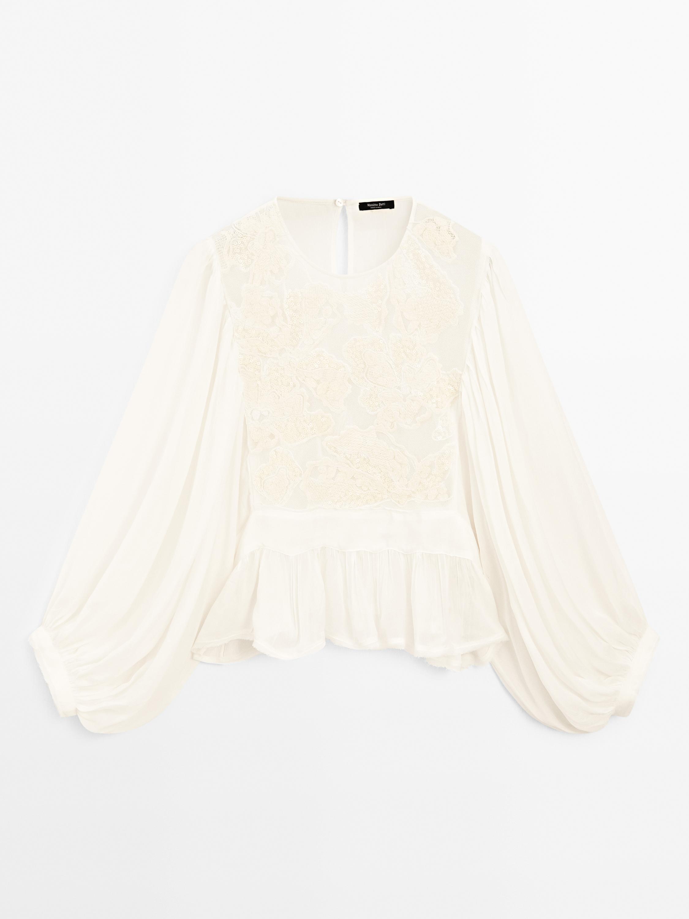 Flowing embroidered peplum blouse