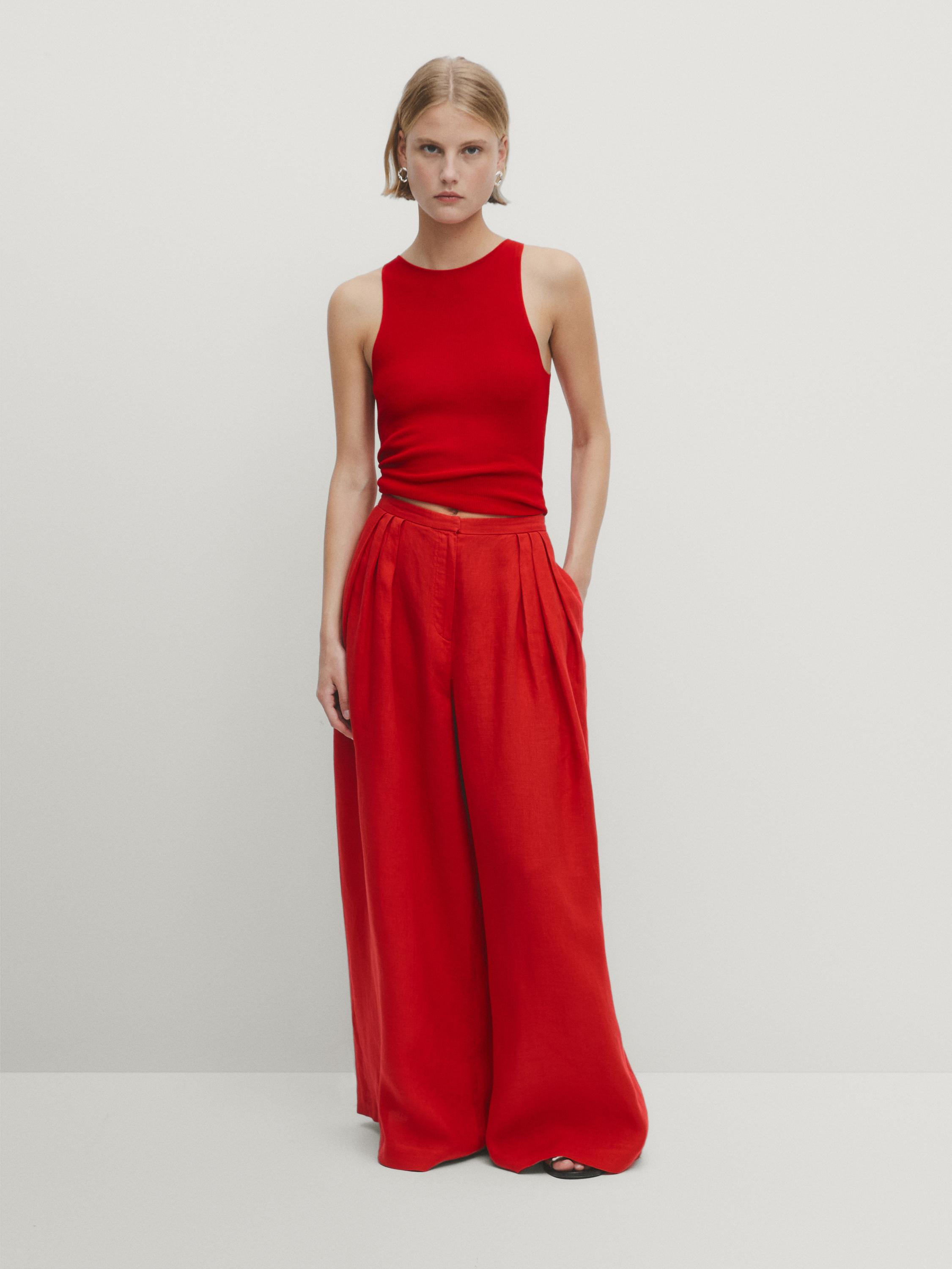 Flared trousers with pleated detail