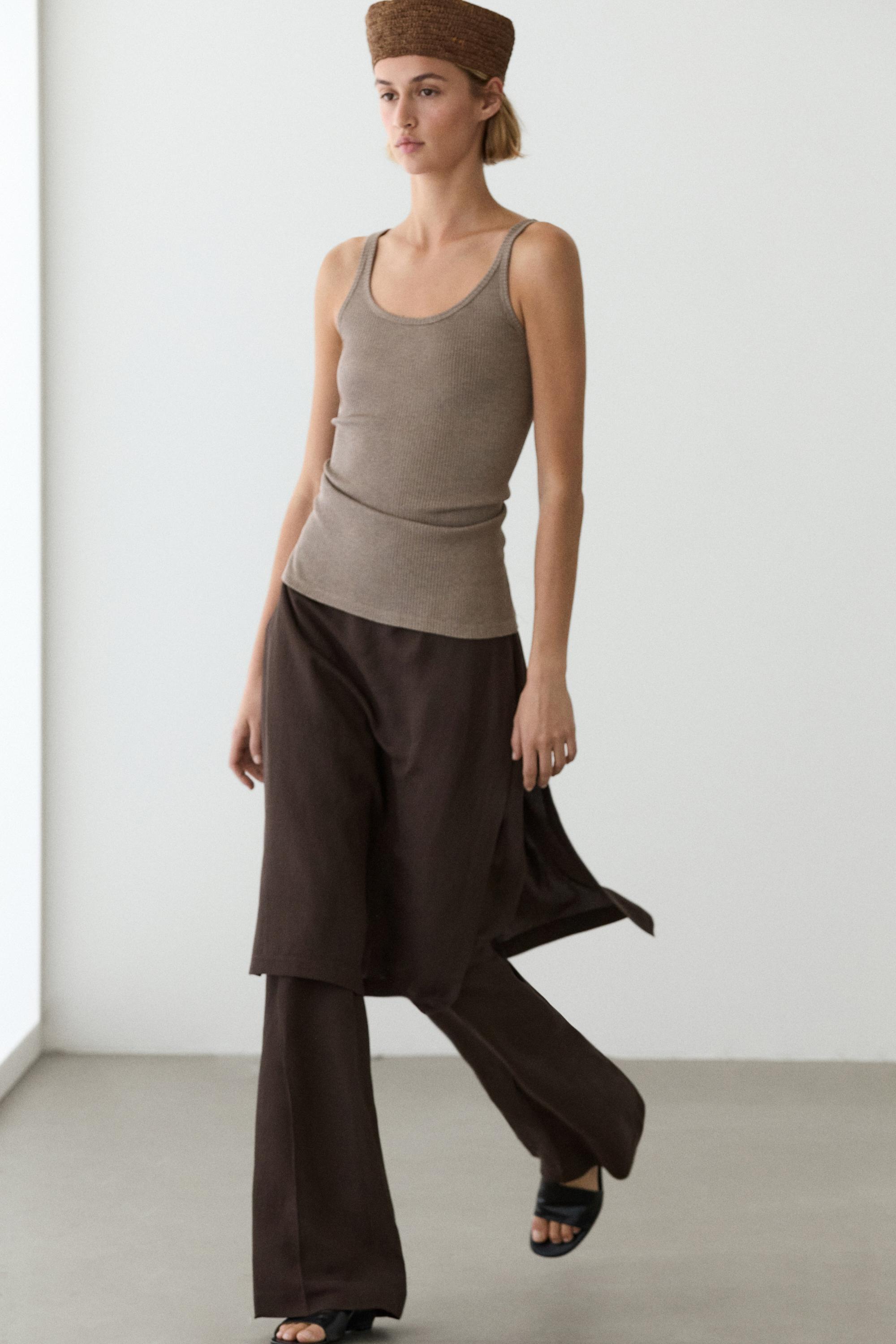 Flowing trousers with skirt detail