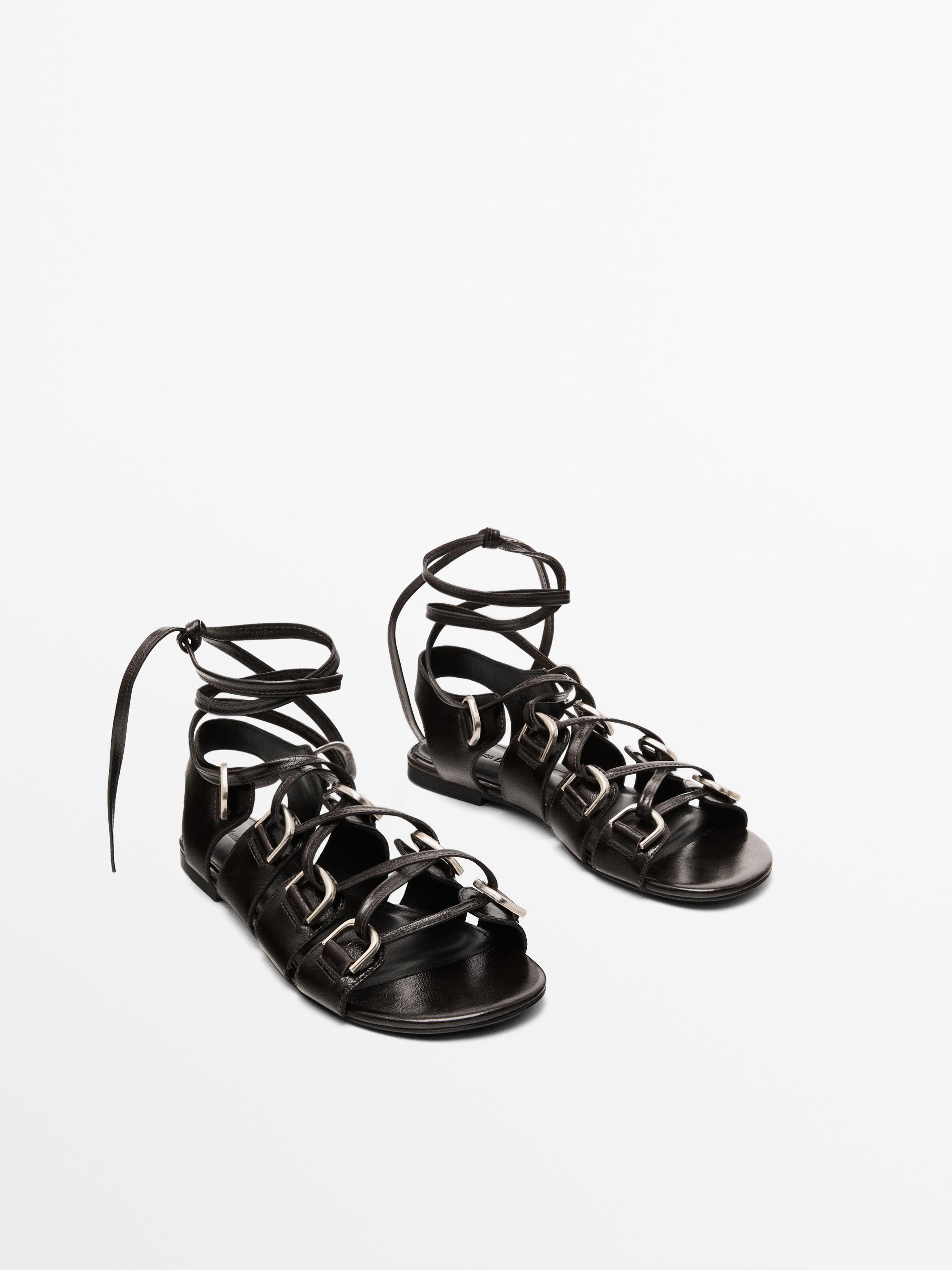 Lace-up sandals with rings