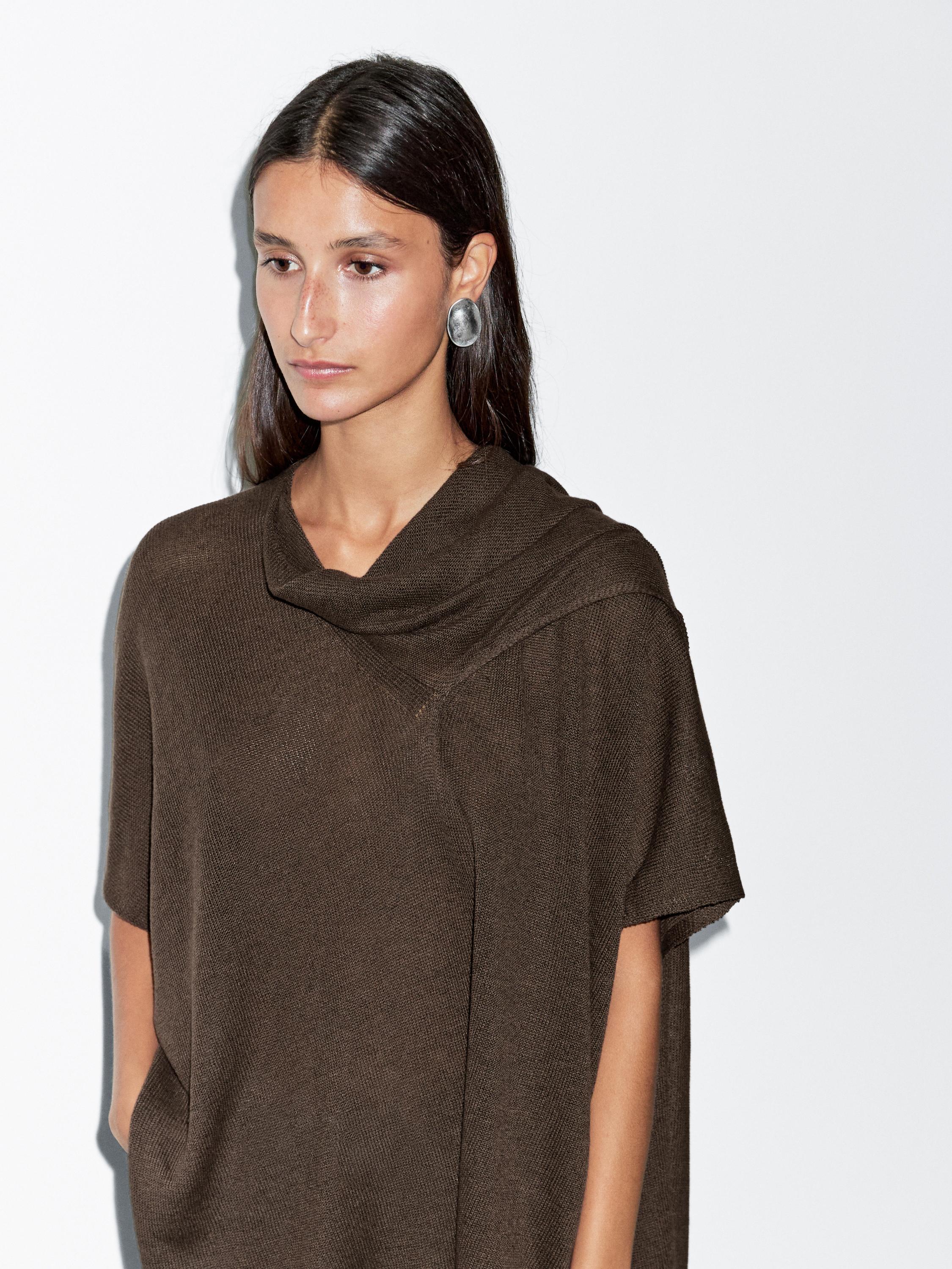 Knit cape with scarf